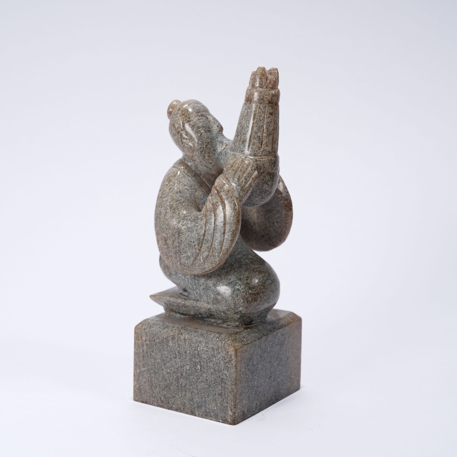 A ANCIENT JADE SEAL WITH SHENG (MOUTH ORGAN) MUSICIAN FIGURE KNOB: Ancient jade seal with sheng (mouth organ) musician figure knob