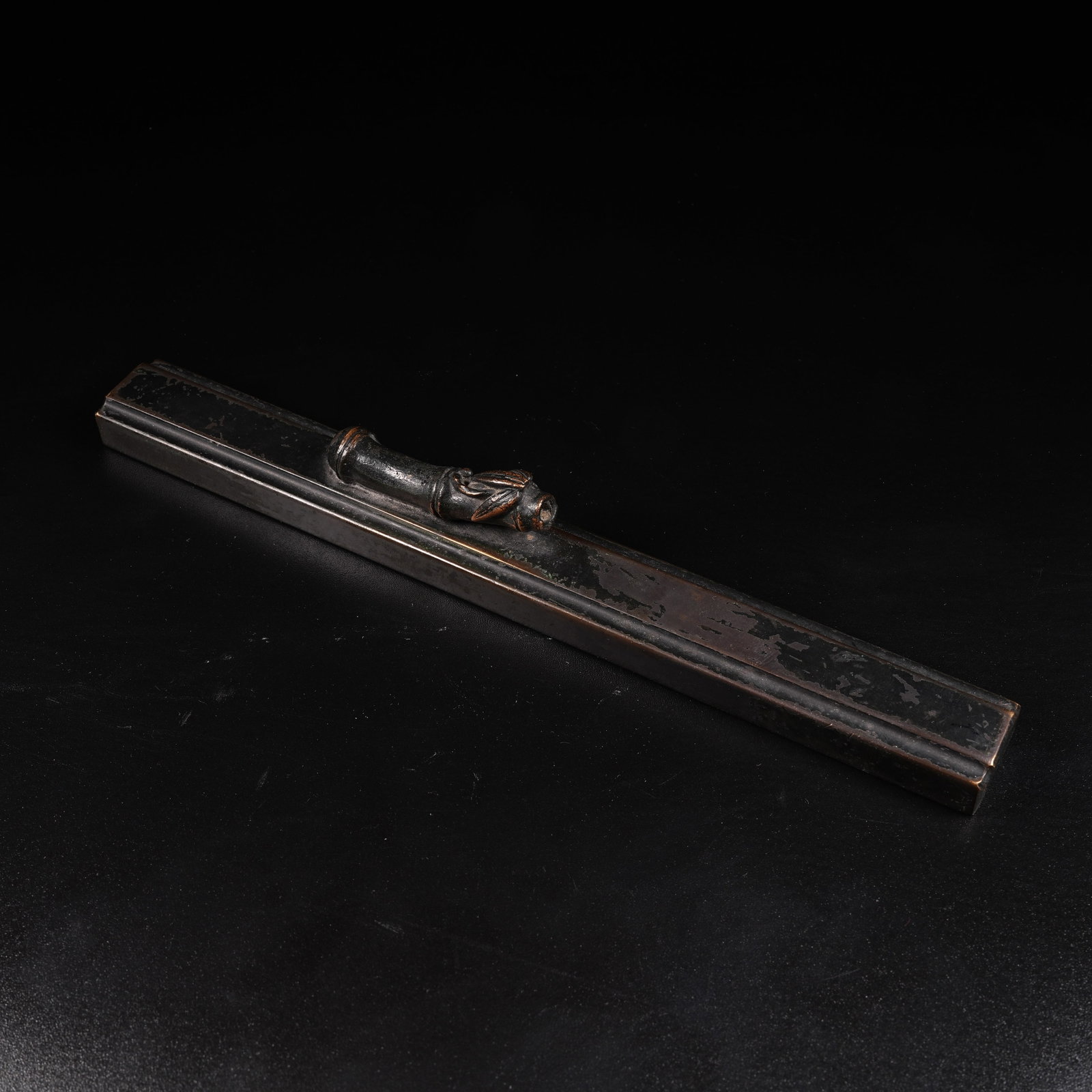 A BRONZE BAMBOO-JOINT PAPERWEIGHT (1 of 9)
