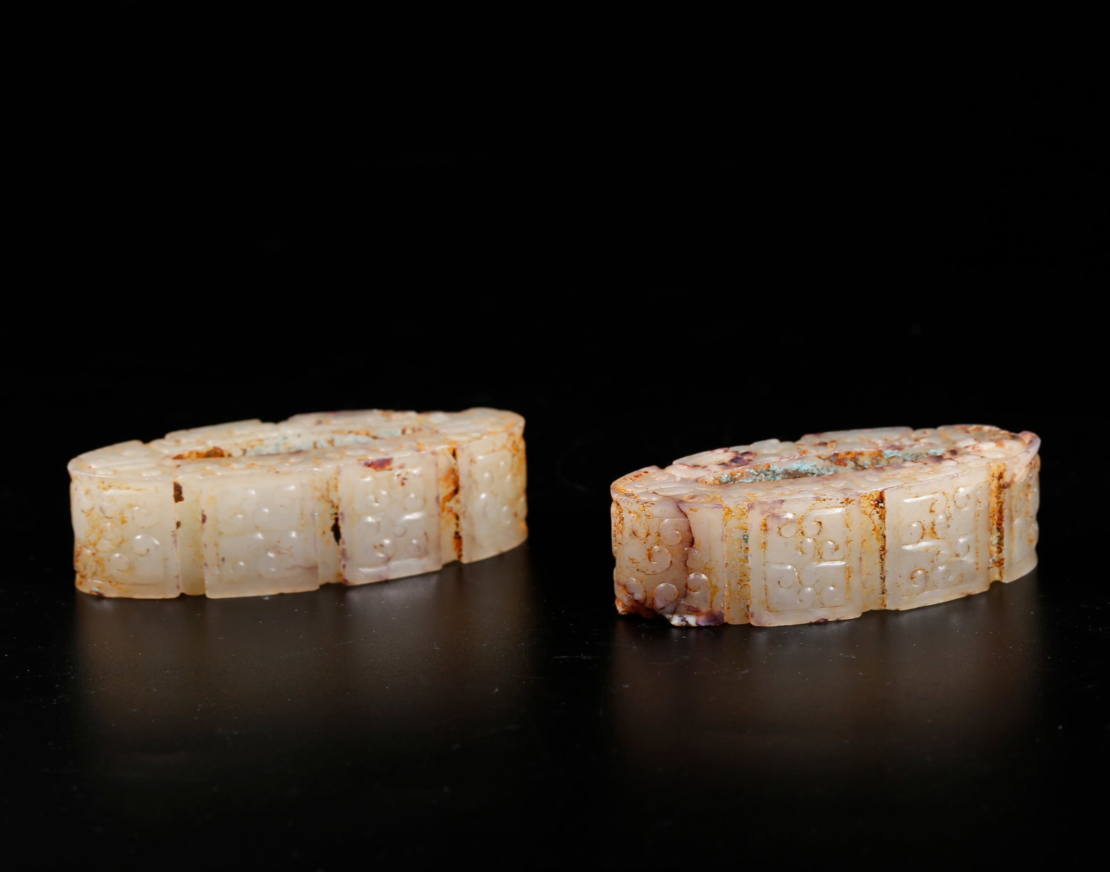 A HETIAN JADE SWORD GUARDS (A PAIR) (1 of 10)