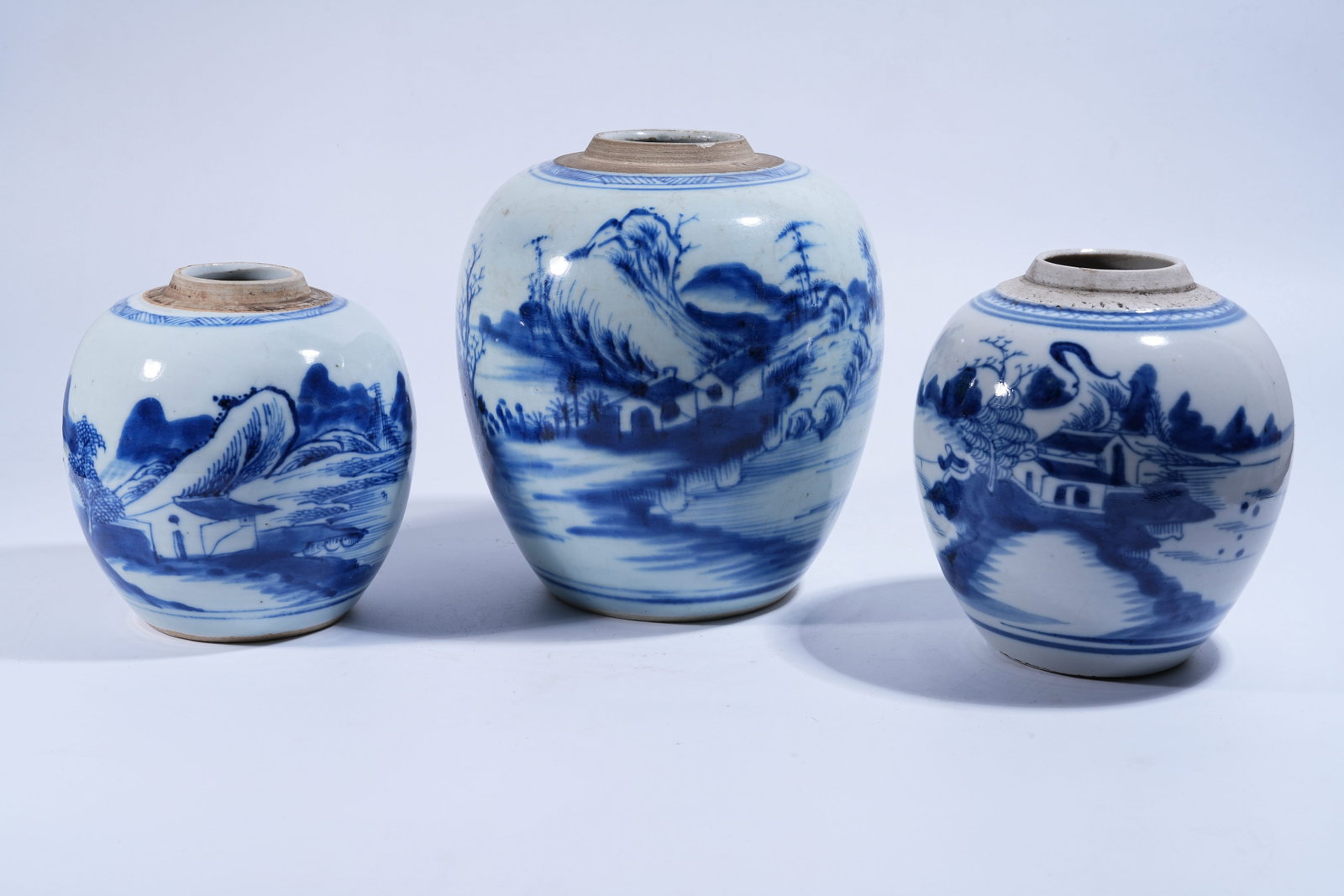 A SET OF THREE BLUE AND WHITE JARS WITH LANDSCAPE AND PAVILION PATTERN (1 of 12)