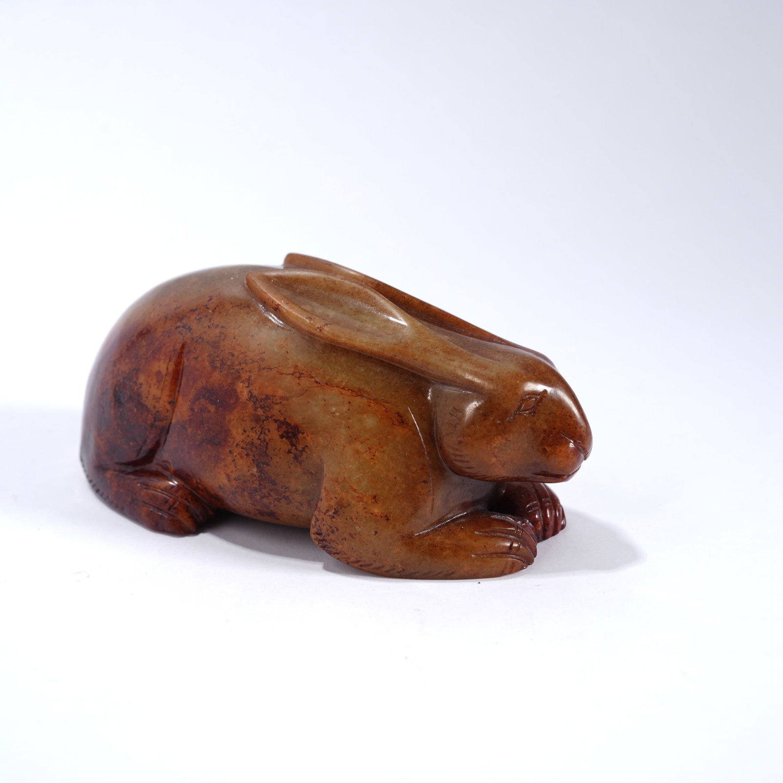 A ANCIENT JADE RECUMBENT RABBIT ORNAMENT (1 of 7)