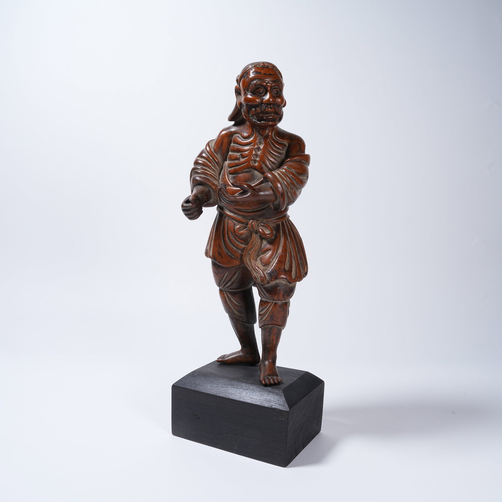 A HUANGHUALI SKINNY ARHAT ORNAMENT: Huanghuali Skinny Arhat Ornament