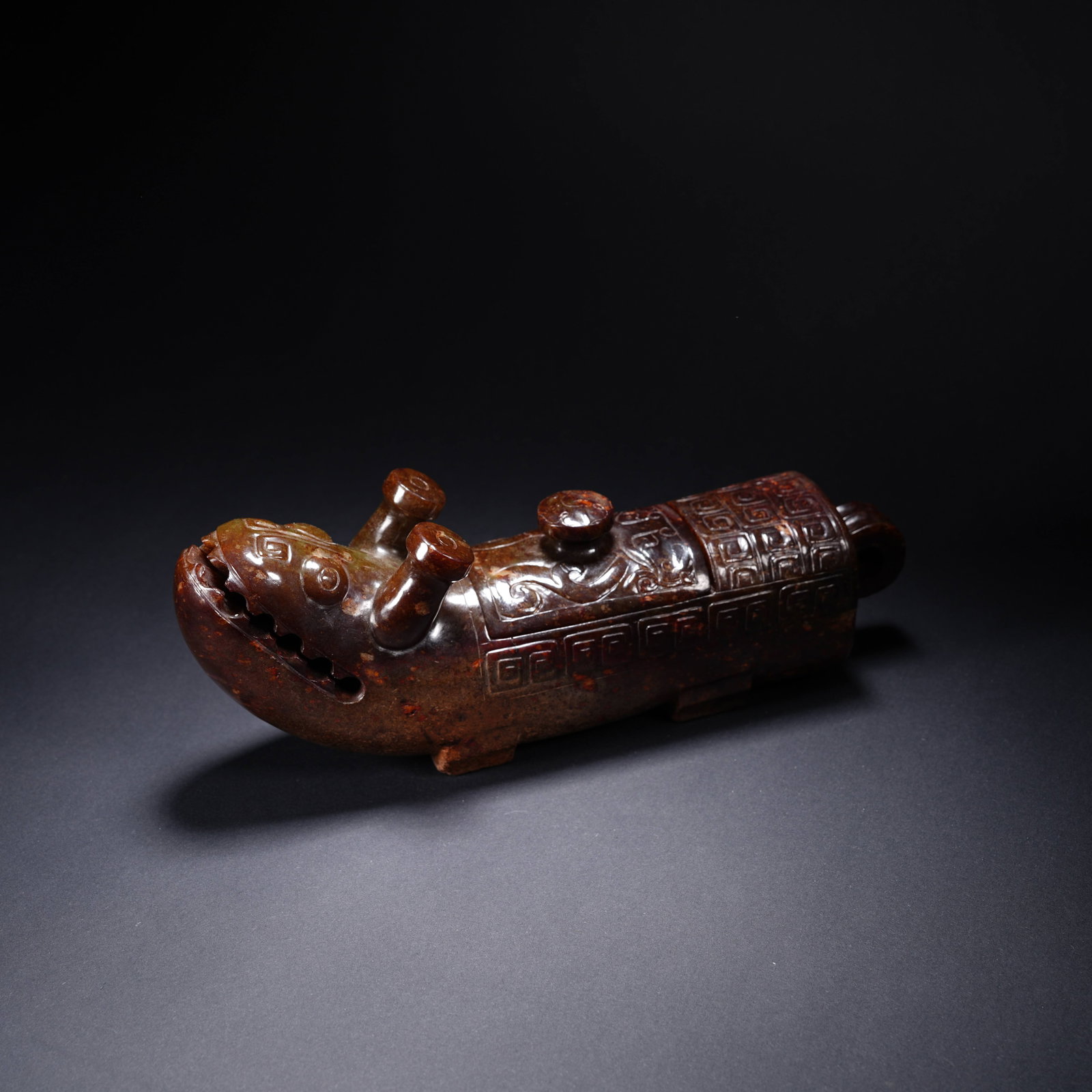 A ANCIENT JADE DOUBLE-HORNED BEAST RITUAL VESSEL (1 of 8)