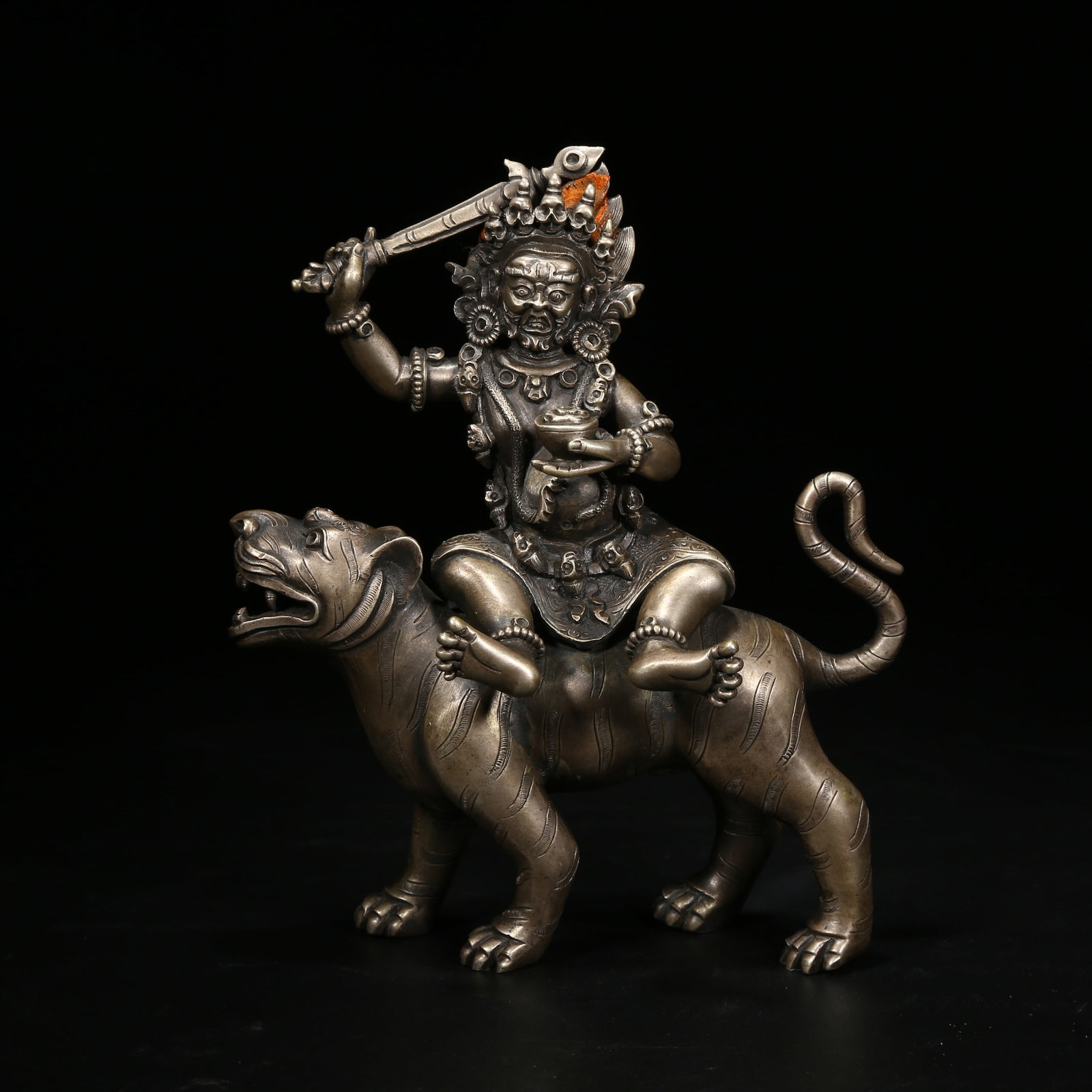 A SILVER GUARDIAN DEITY STATUE (1 of 8)