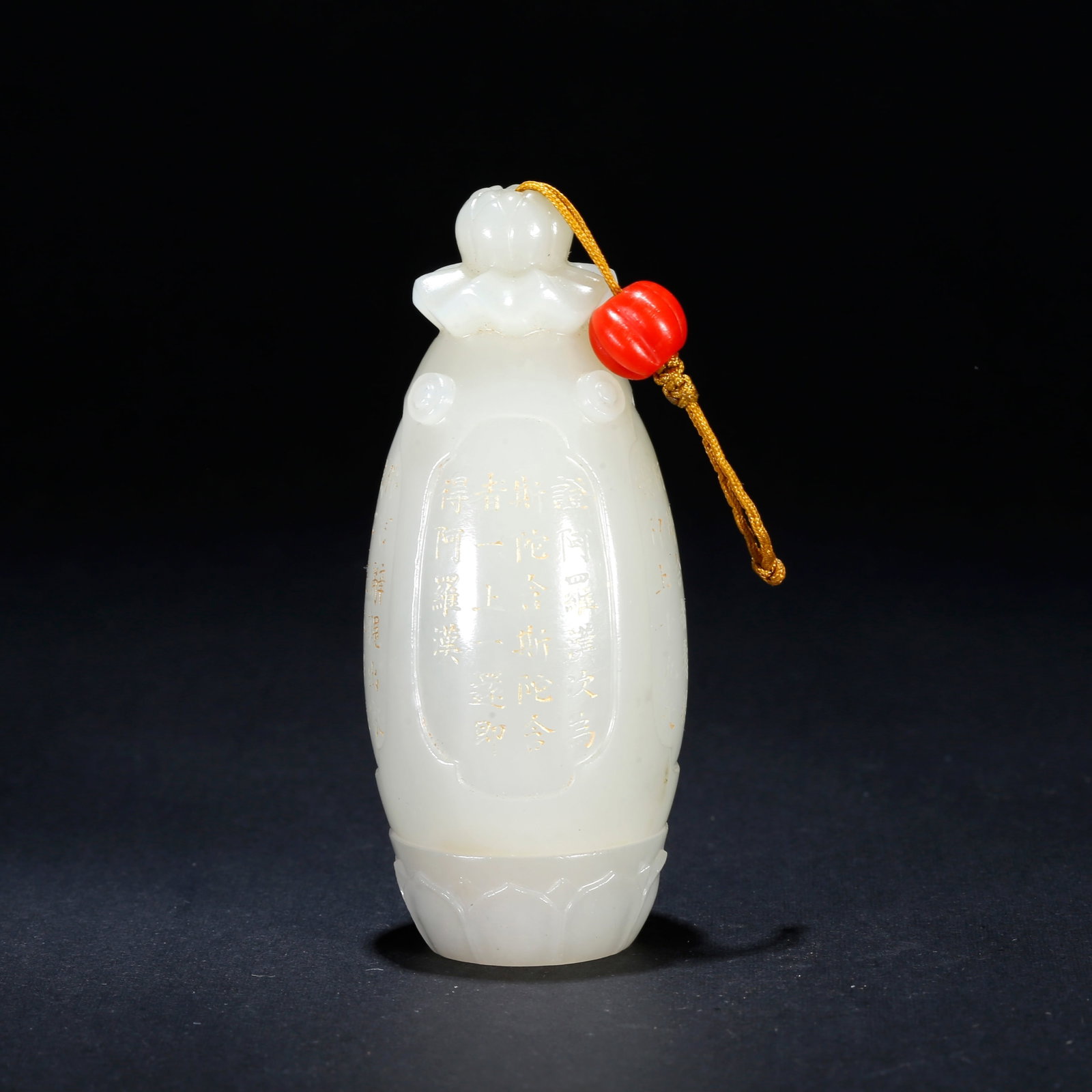 A HETIAN JADE CARVED BUDDHA PENDANT: Hetian Jade Carved Buddha Pendant