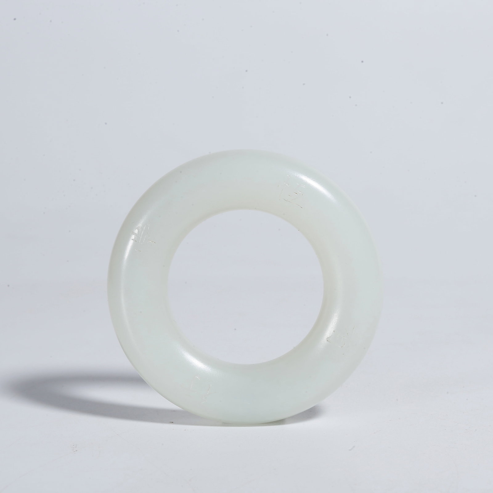 A HETIAN JADE CARVED MINIATURE LINKED BI DISC: Hetian Jade Carved Miniature Linked Bi Disc