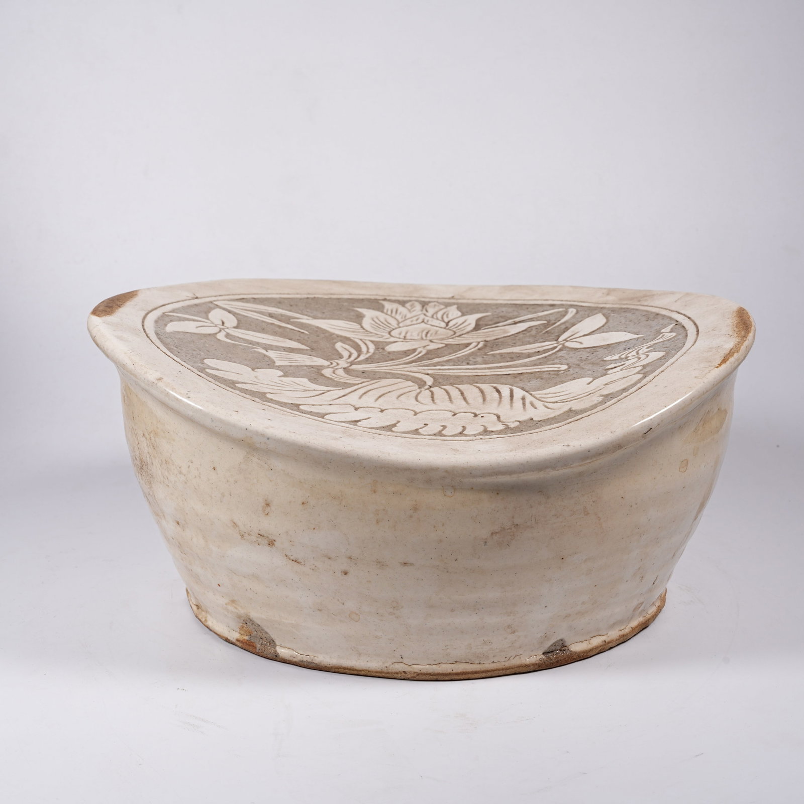 A CIZHOU KILN PILLOW WITH FLORAL PATTERN: Cizhou Kiln Pillow with Floral Pattern