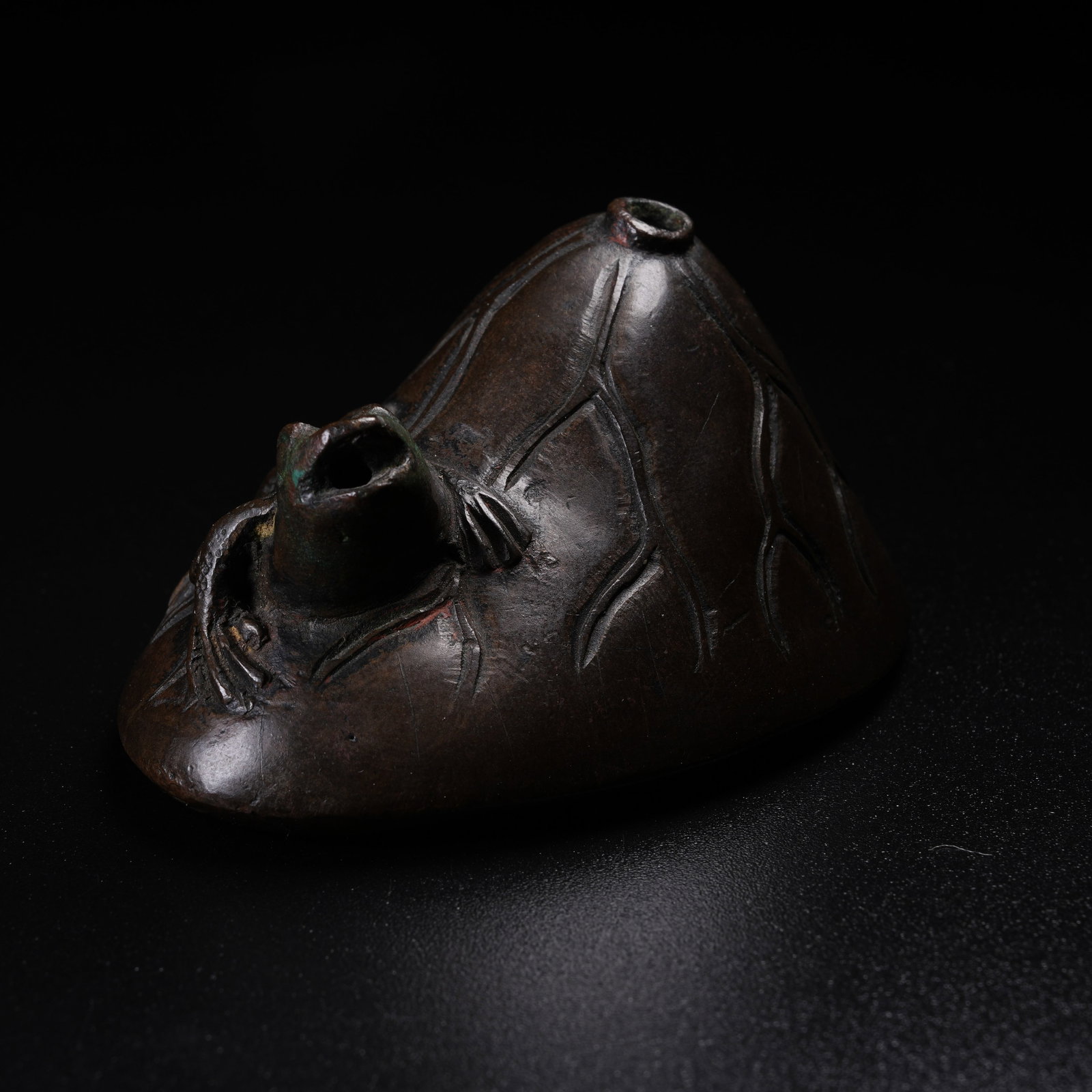 A BRONZE INK DROPPER WITH LOTUS SEEDPOD AND FROG PATTERN: Bronze Ink Dropper with Lotus Seedpod and Frog Pattern