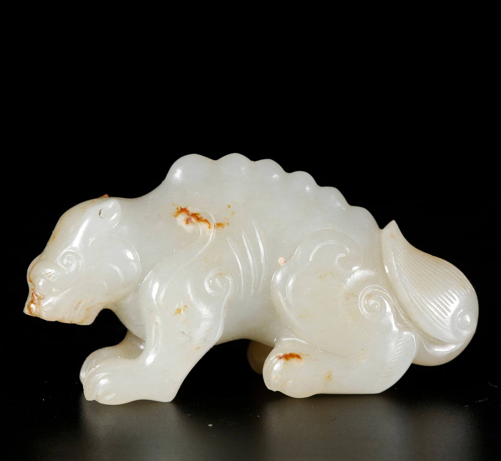 A BEAST-SHAPED ORNAMENT CARVED FROM HETIAN JADE: Beast-shaped Ornament Carved from Hetian Jade