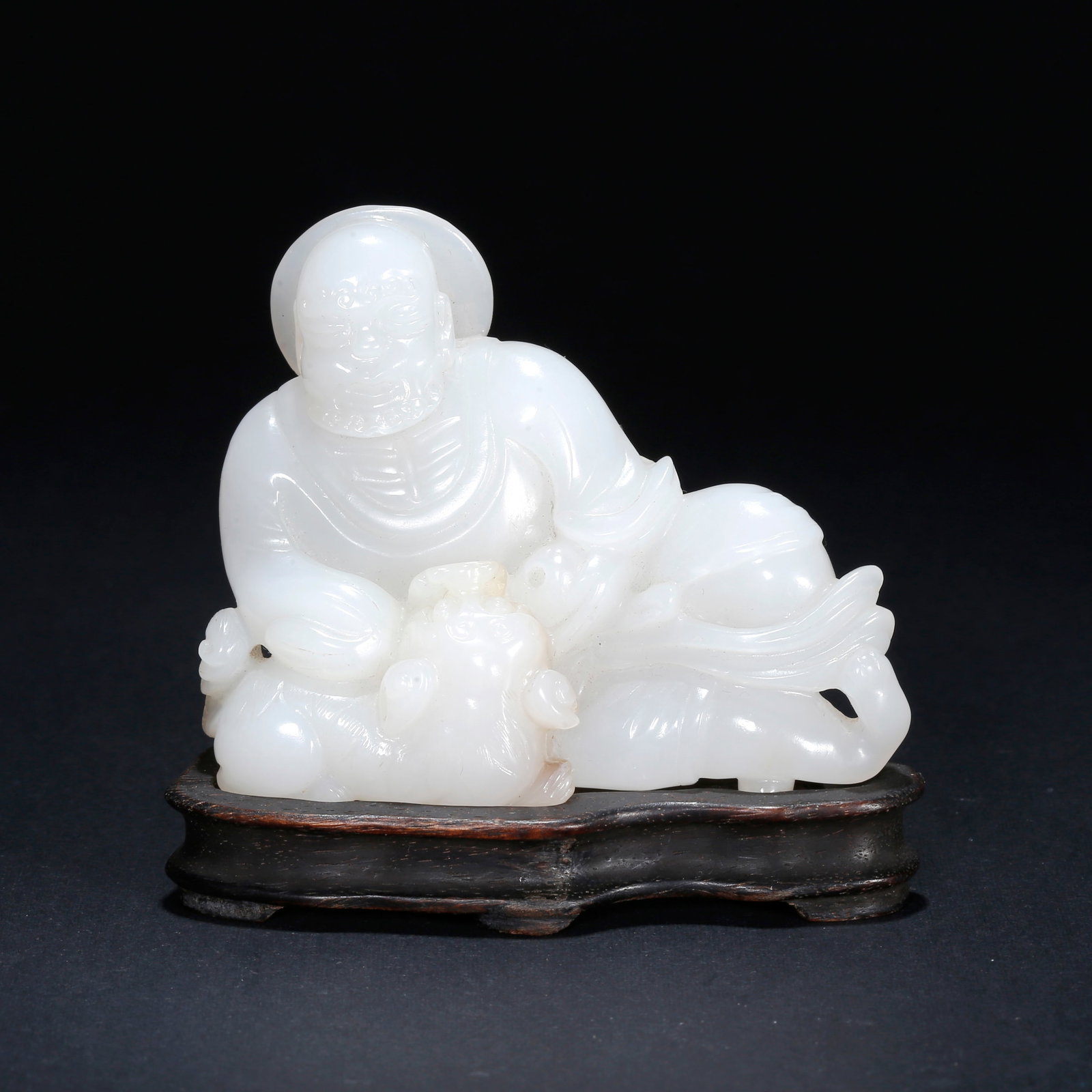 A HETIAN JADE CARVED ARHAT ORNAMENT (1 of 9)