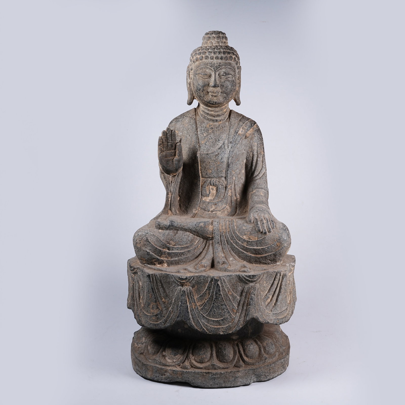 A BLUESTONE AMOGHASIDDHI BUDDHA STATUE: Bluestone Amoghasiddhi Buddha Statue