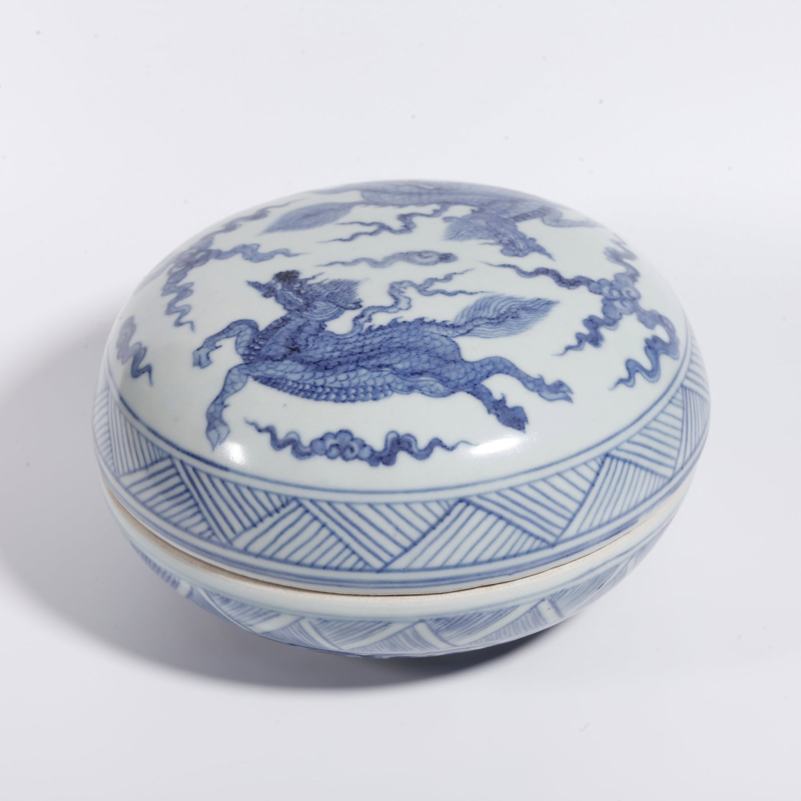 A BLUE AND WHITE QILIN PATTERN HOLDING BOX: Blue and White Qilin Pattern Holding Box