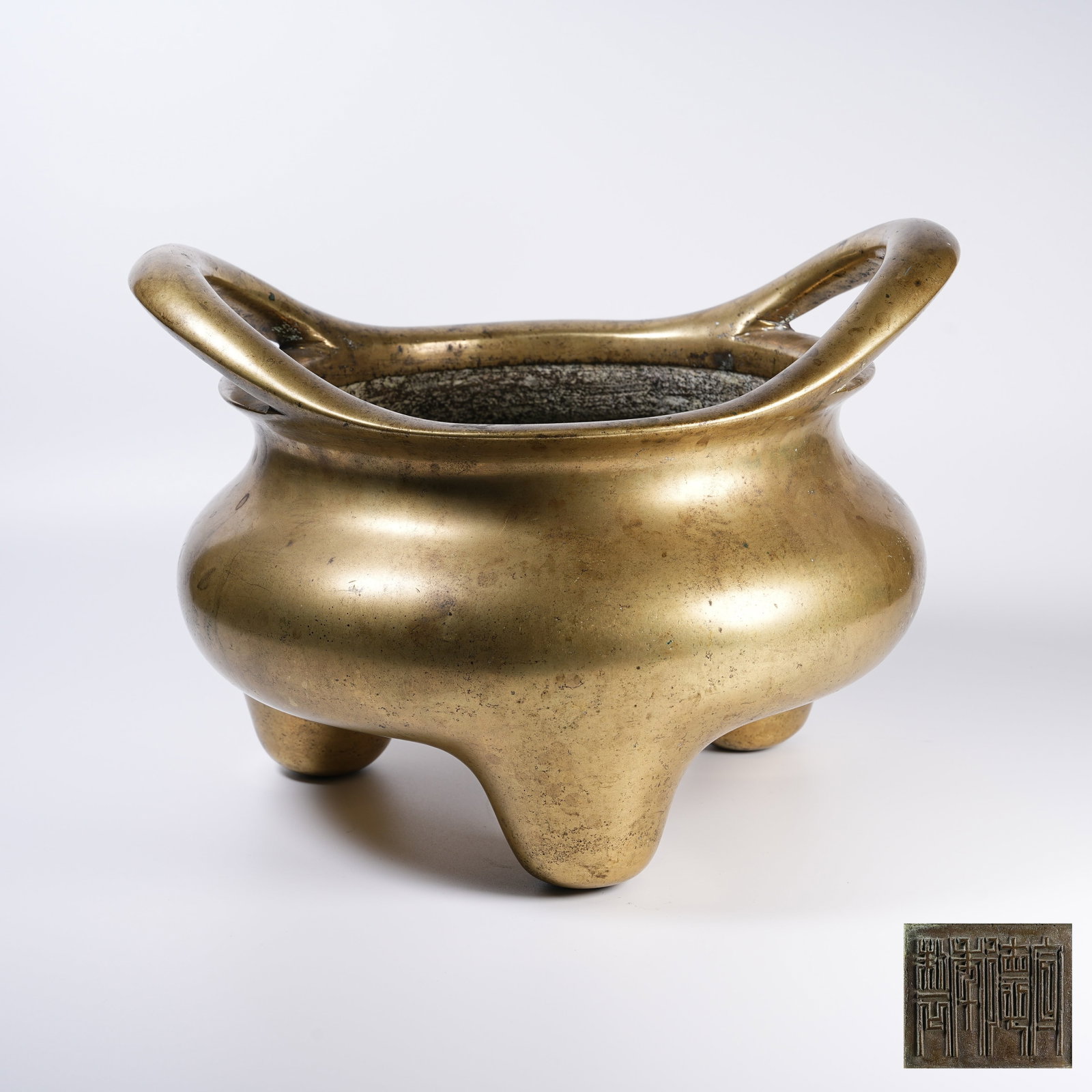 A THREE-LEGGED BRONZE BRIDGE-EARED CENSER (1 of 9)