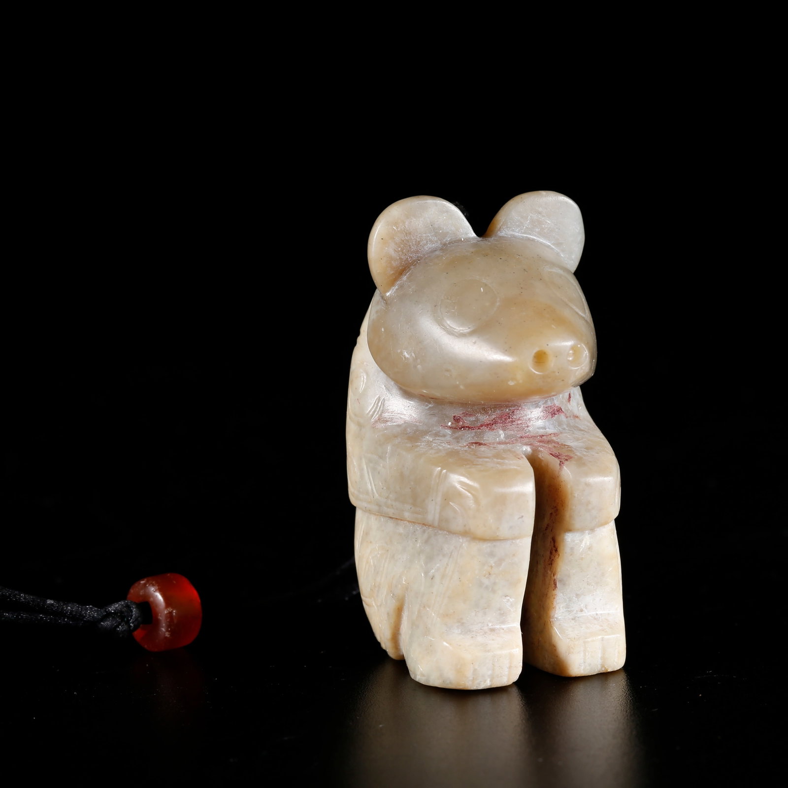 A BEAR-SHAPED HANDHELD CARVING FROM HETIAN JADE: Bear-shaped Handheld Carving from Hetian Jade
