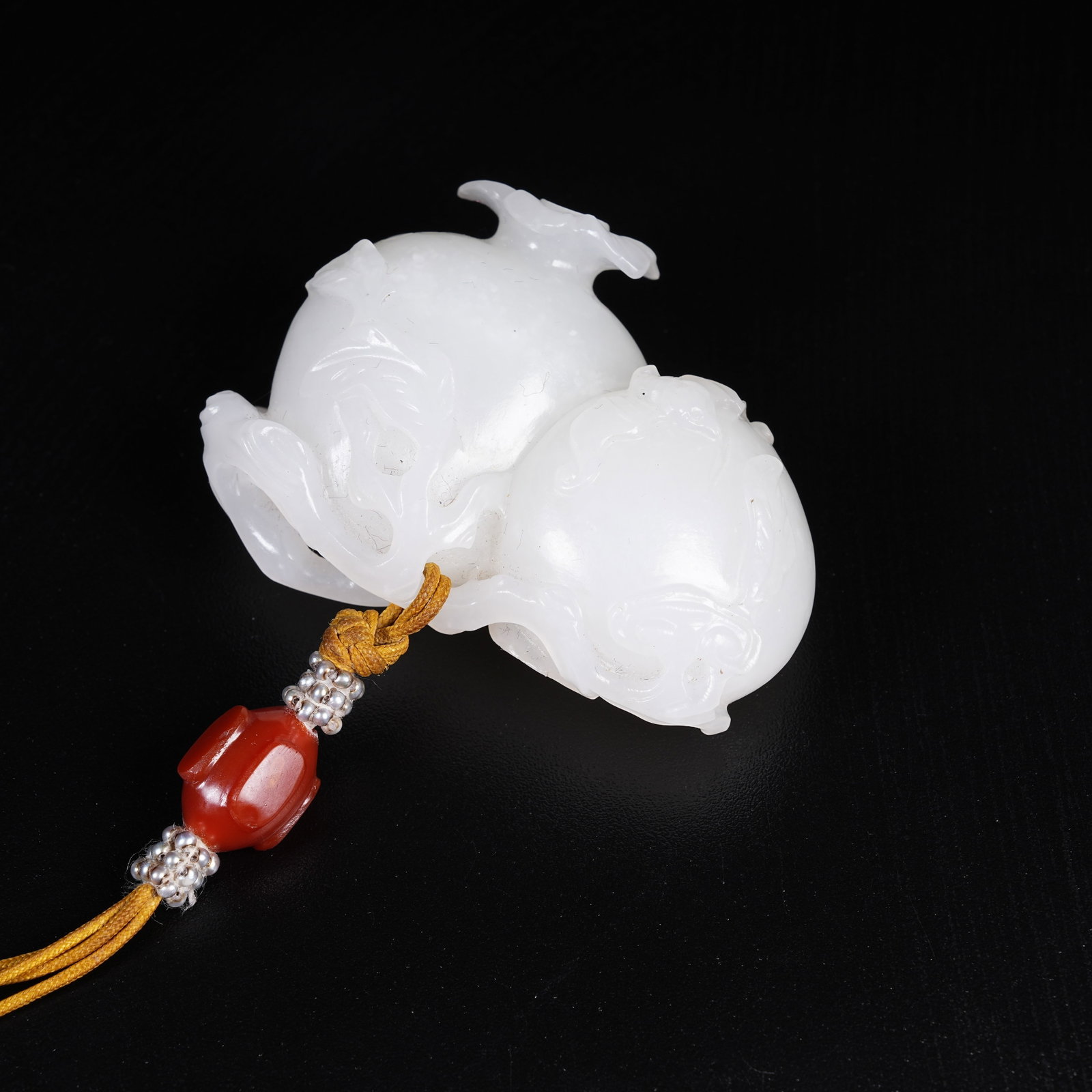A HETIAN JADE PENDANT WITH MULTI-BLESSING PATTERN: Hetian Jade Pendant with Multi-blessing Pattern