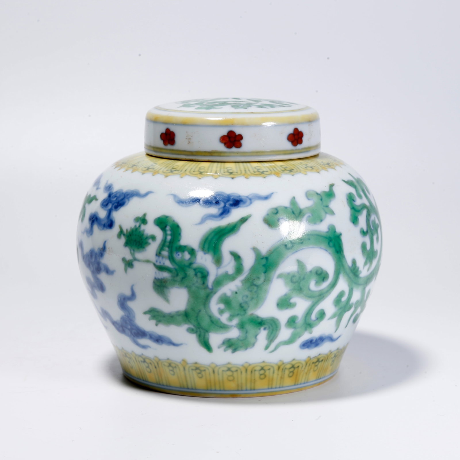 A DOUCAI COVERED JAR WITH CLOUD AND DRAGON PATTERN: Doucai Covered Jar with Cloud and Dragon Pattern