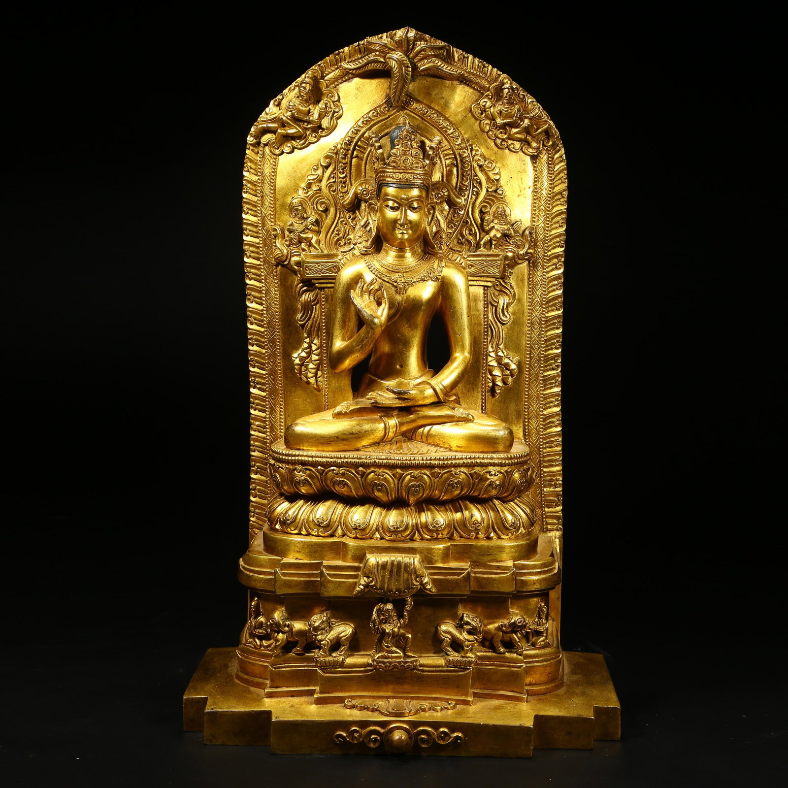 A GILT BRONZE STATUE OF SHAKYAMUNI BUDDHA PREACHING: Gilt bronze statue of Shakyamuni Buddha preaching