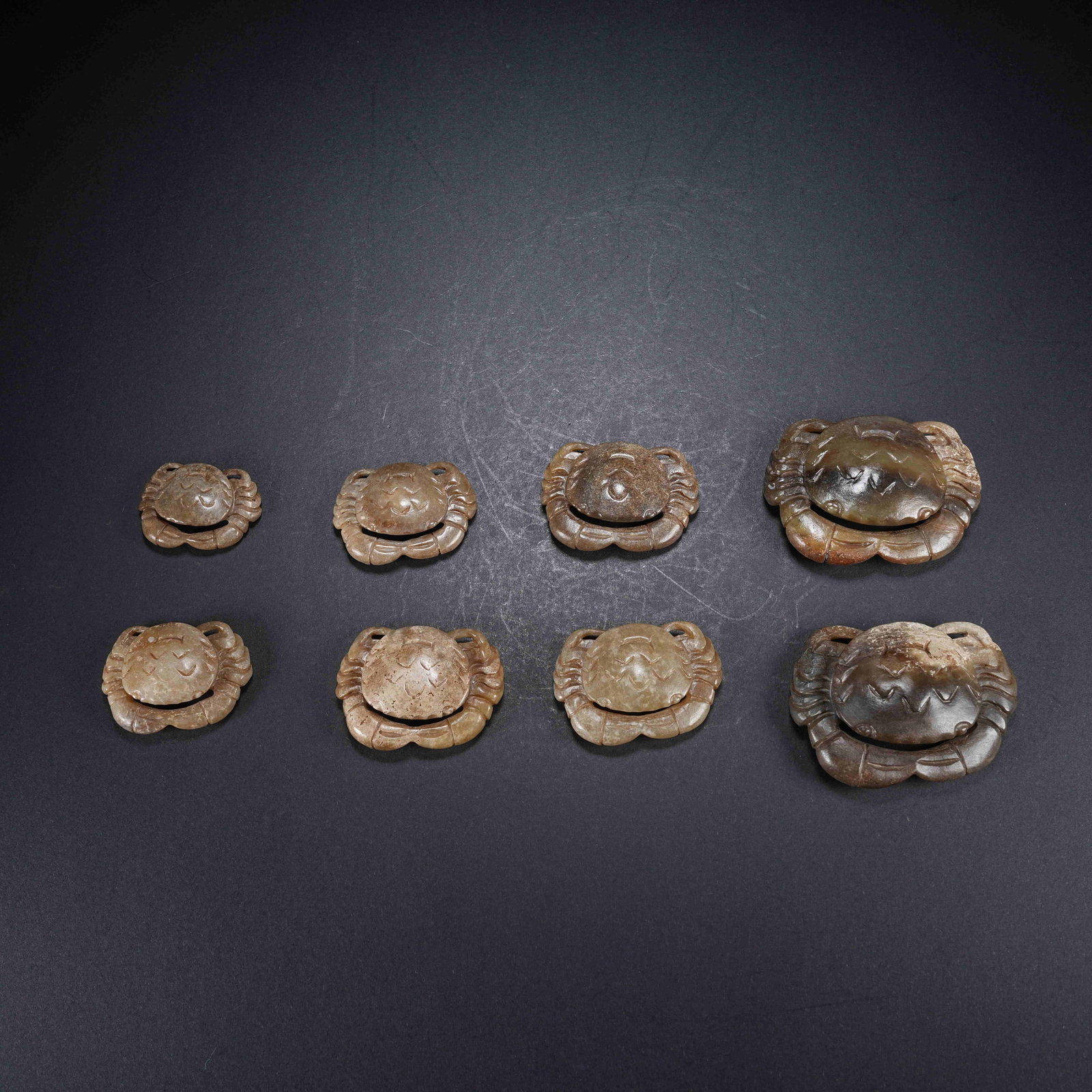 A SET OF EIGHT ARCHAIC JADE CRABS (1 of 11)