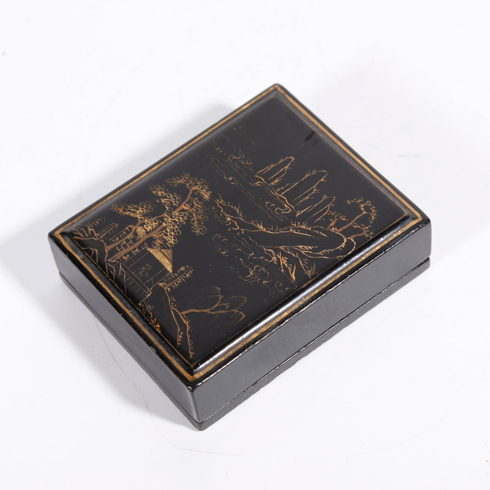 A GILT LACQUER COVERED BOX WITH LANDSCAPE PATTERN: Gilt Lacquer Covered Box with Landscape Pattern