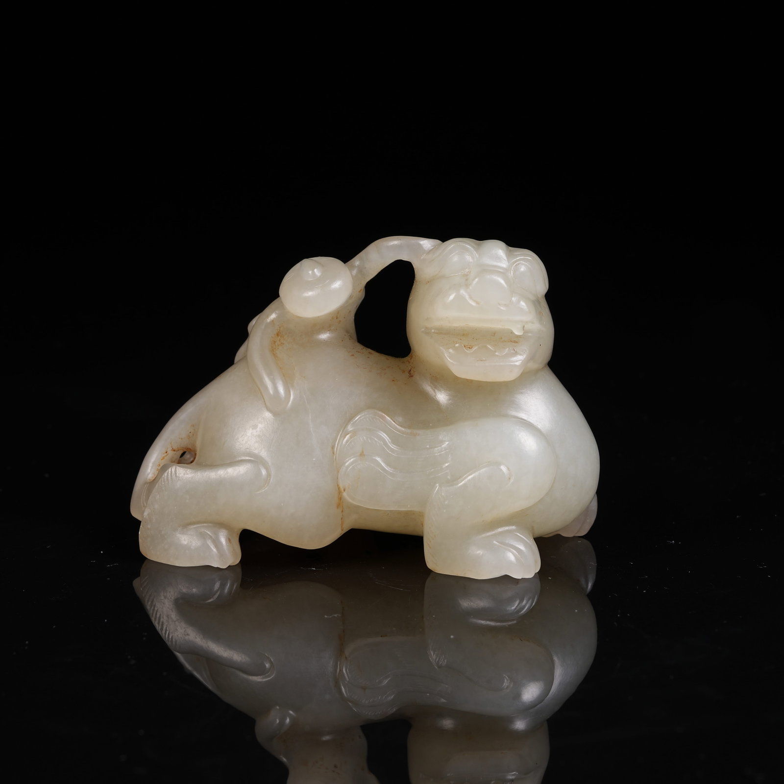 A ARCHAIC JADE ORNAMENT OF WINGED MAN RIDING BEAST: Archaic Jade Ornament of Winged Man Riding Beast