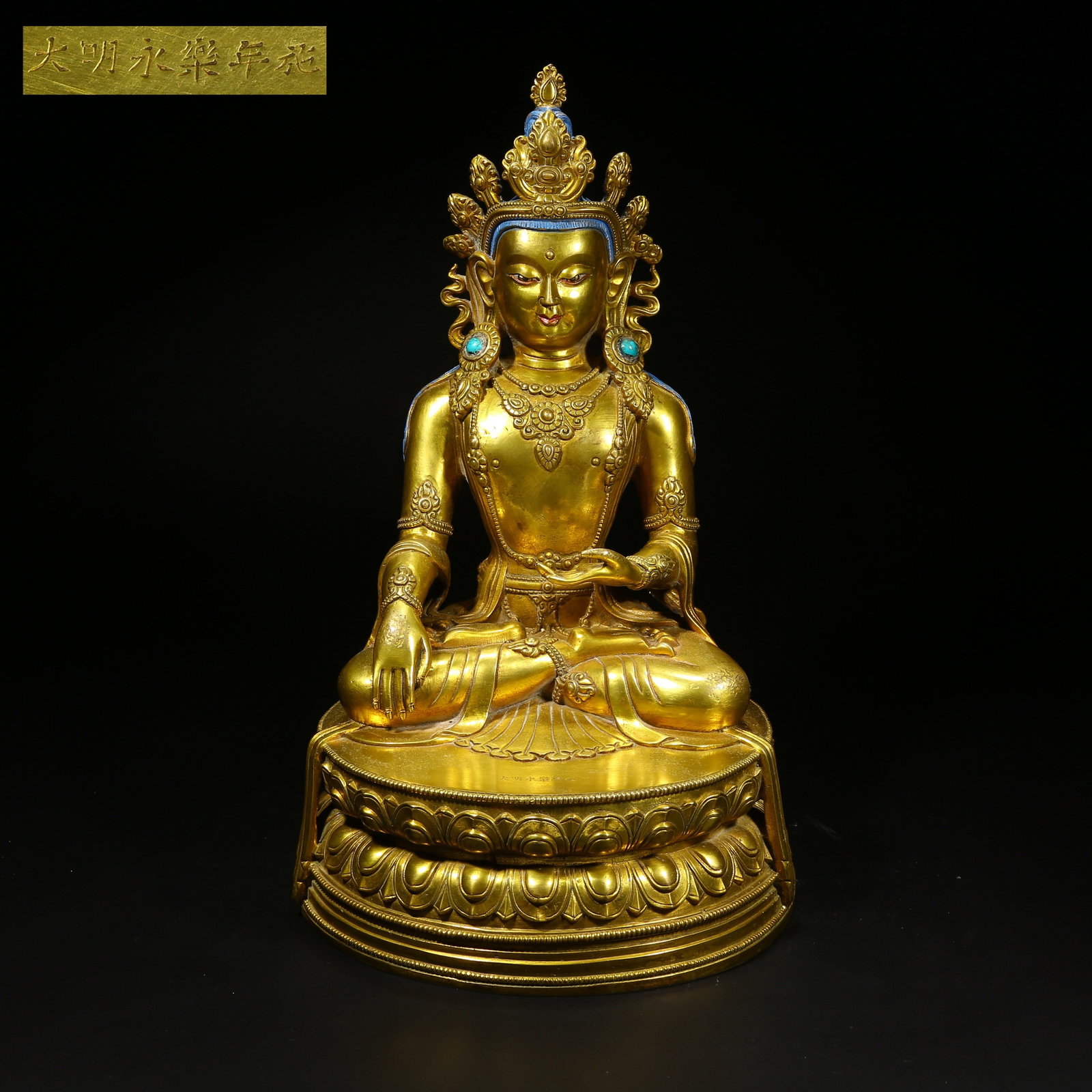 A GILT BRONZE STATUE OF SHAKYAMUNI BUDDHA WITH JEWELED CROWN: Gilt bronze statue of Shakyamuni Buddha with jeweled crown