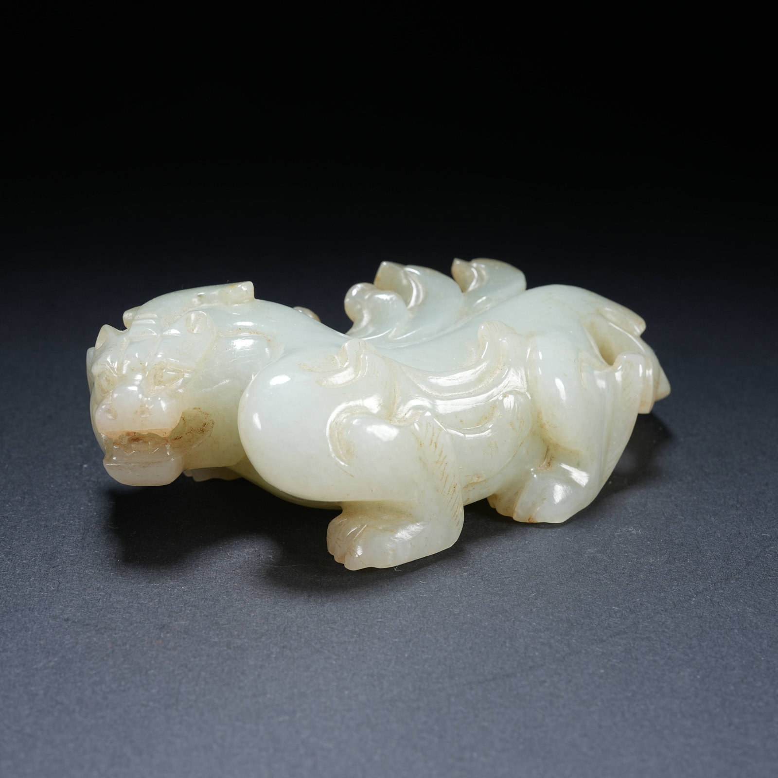 A HETIAN JADE AUSPICIOUS BEAST ORNAMENT: Hetian Jade Auspicious Beast Ornament