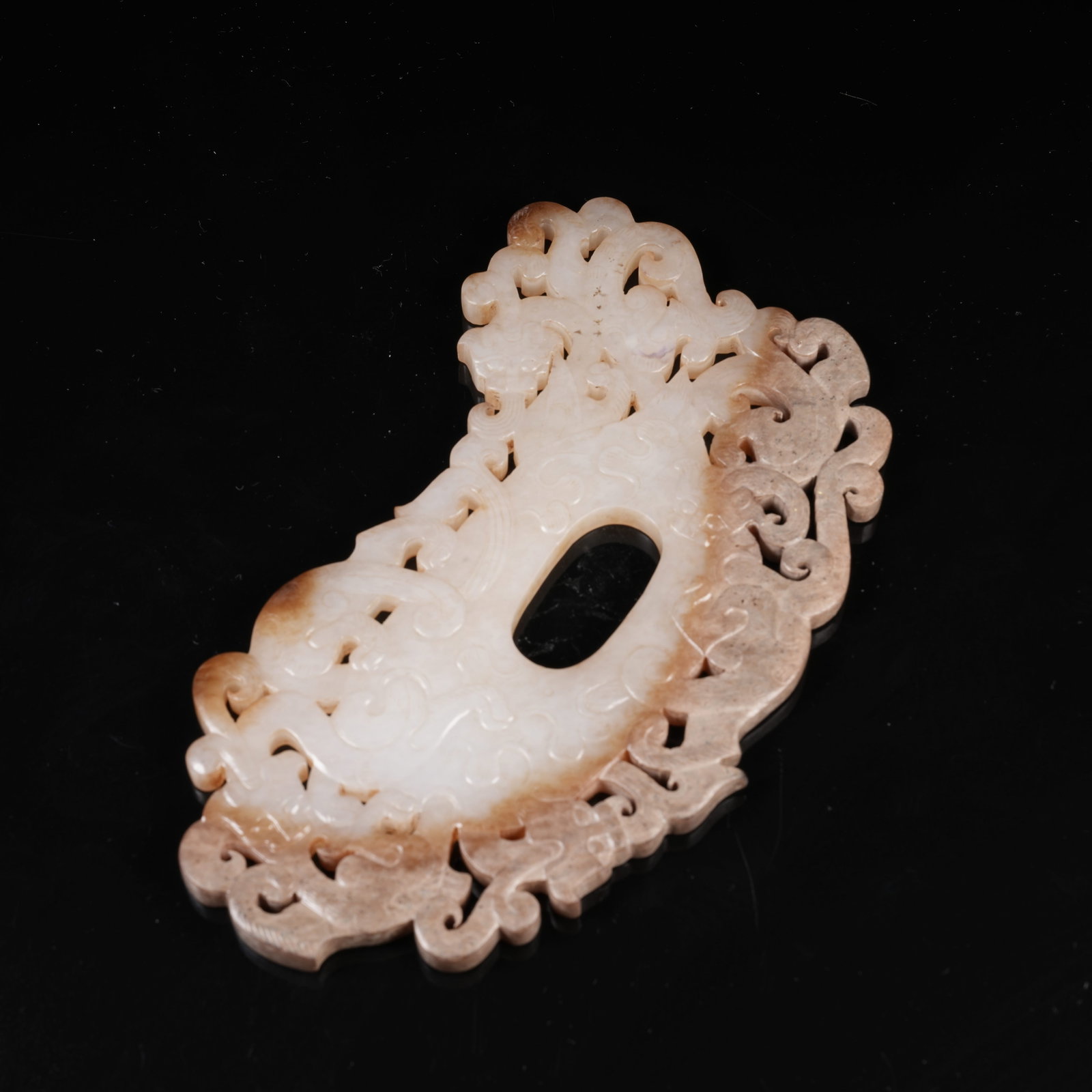 A ARCHAIC JADE HEART-SHAPED PENDANT WITH CHI DRAGON MOTIF (1 of 8)