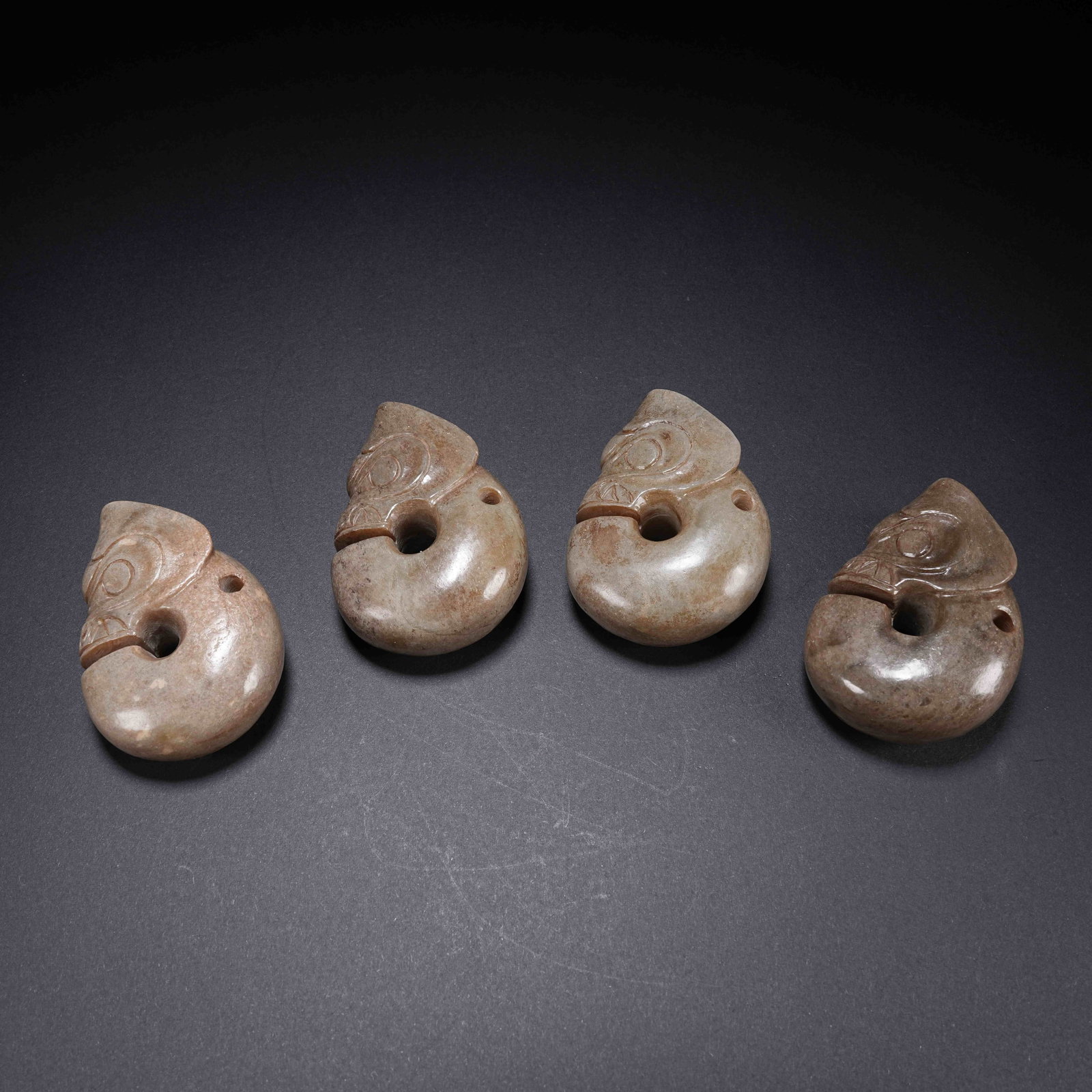 A ANCIENT JADE HONGSHAN CULTURE PIG DRAGONS (1 of 10)