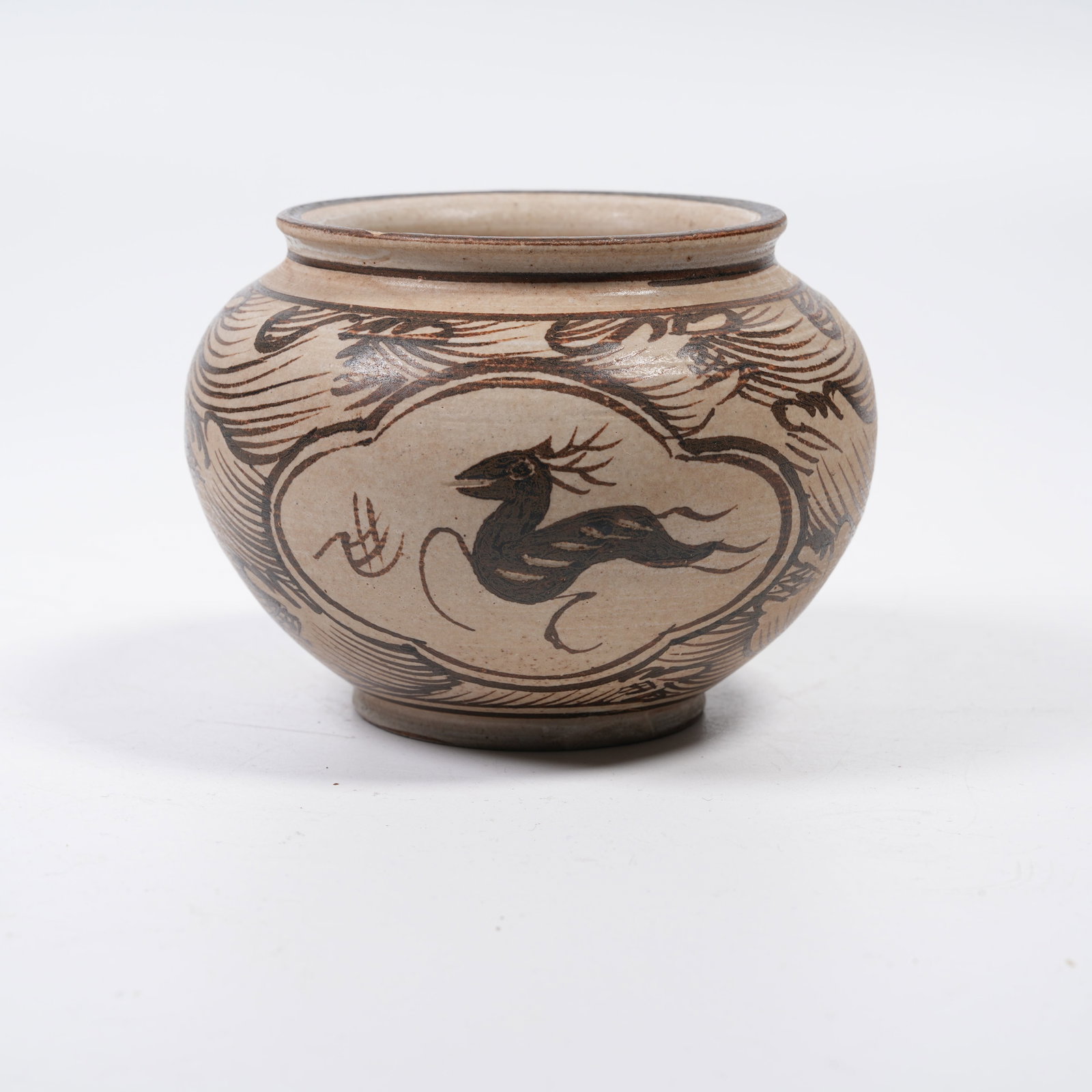 A JIZHOUYAO SMALL JAR WITH SEA WAVE PATTERNS: Jizhouyao Small Jar with Sea Wave Patterns