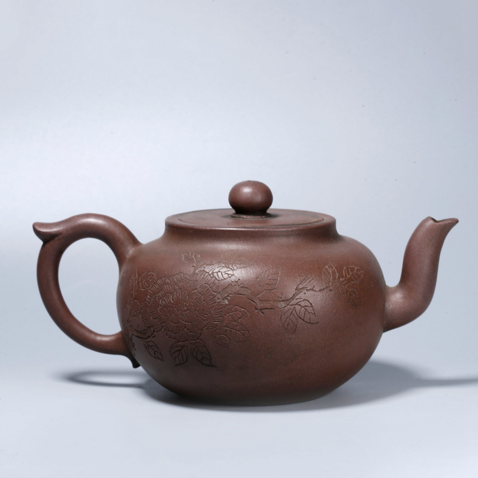 A ZISHA TEAPOT CARVED WITH POETIC INSCRIPTIONS: Zisha Teapot Carved with Poetic Inscriptions
