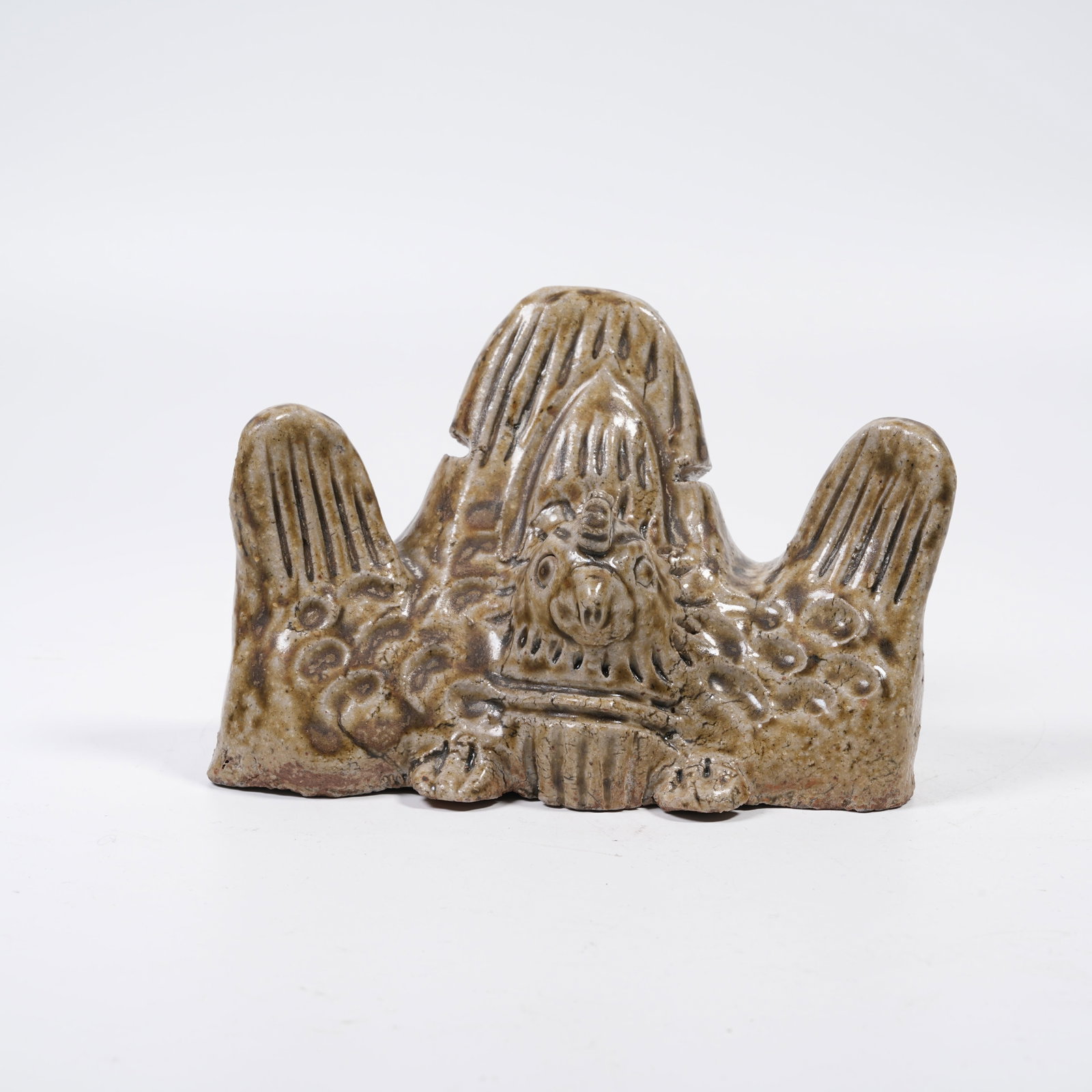 A YUEYAO BOULDER-SHAPED BRUSH REST WITH PHOENIX HEAD: Yueyao Boulder-shaped Brush Rest with Phoenix Head