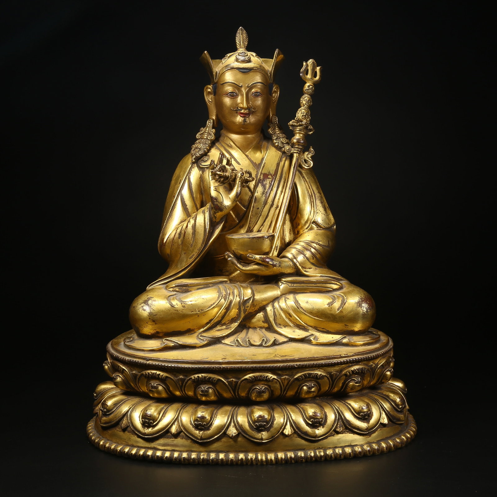 A GILT BRONZE STATUE OF PADMASAMBHAVA: Gilt bronze statue of Padmasambhava