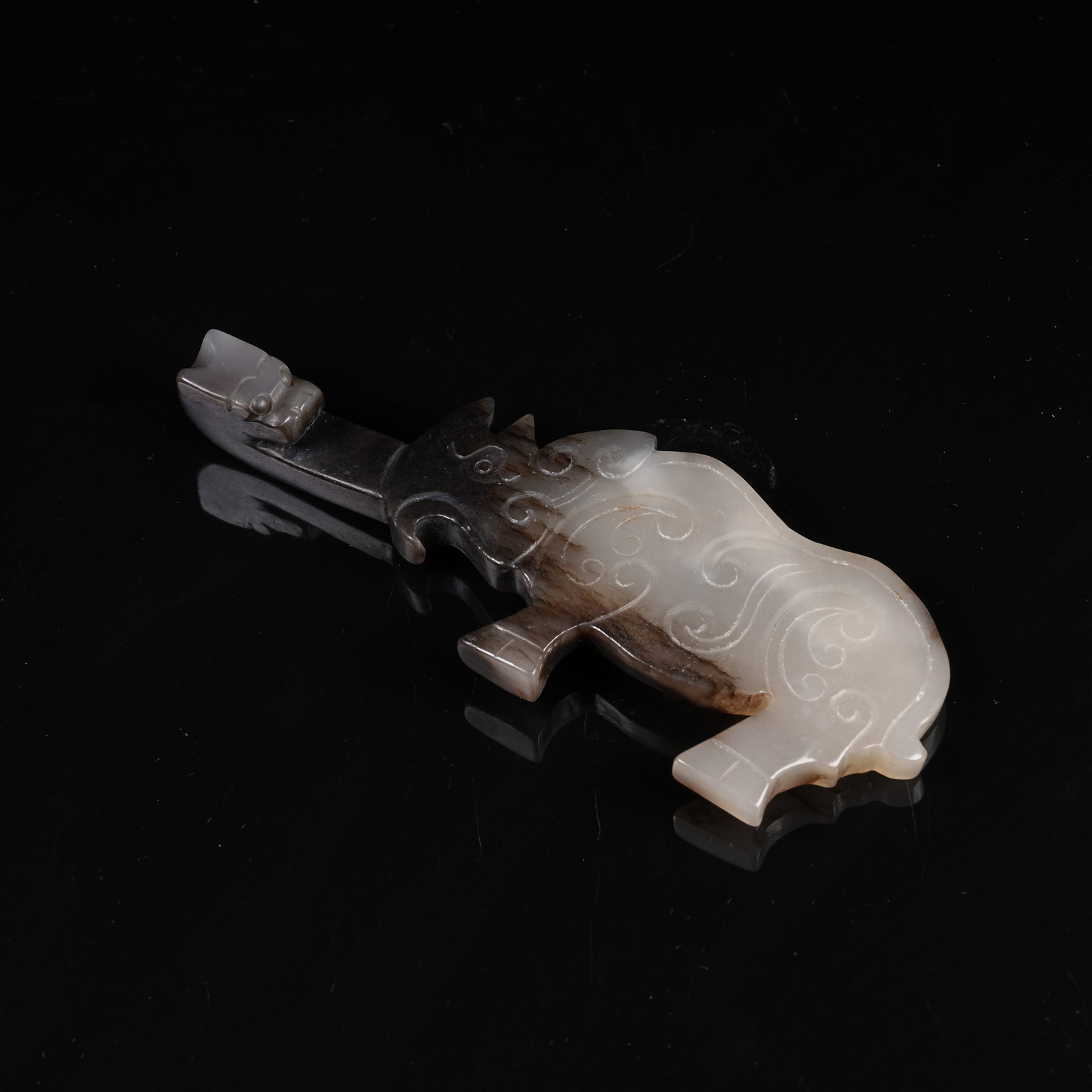 A ARCHAIC JADE DRAGON-HEADED BELT HOOK WITH BEAST PATTERN: Archaic Jade Dragon-Headed Belt Hook with Beast Pattern