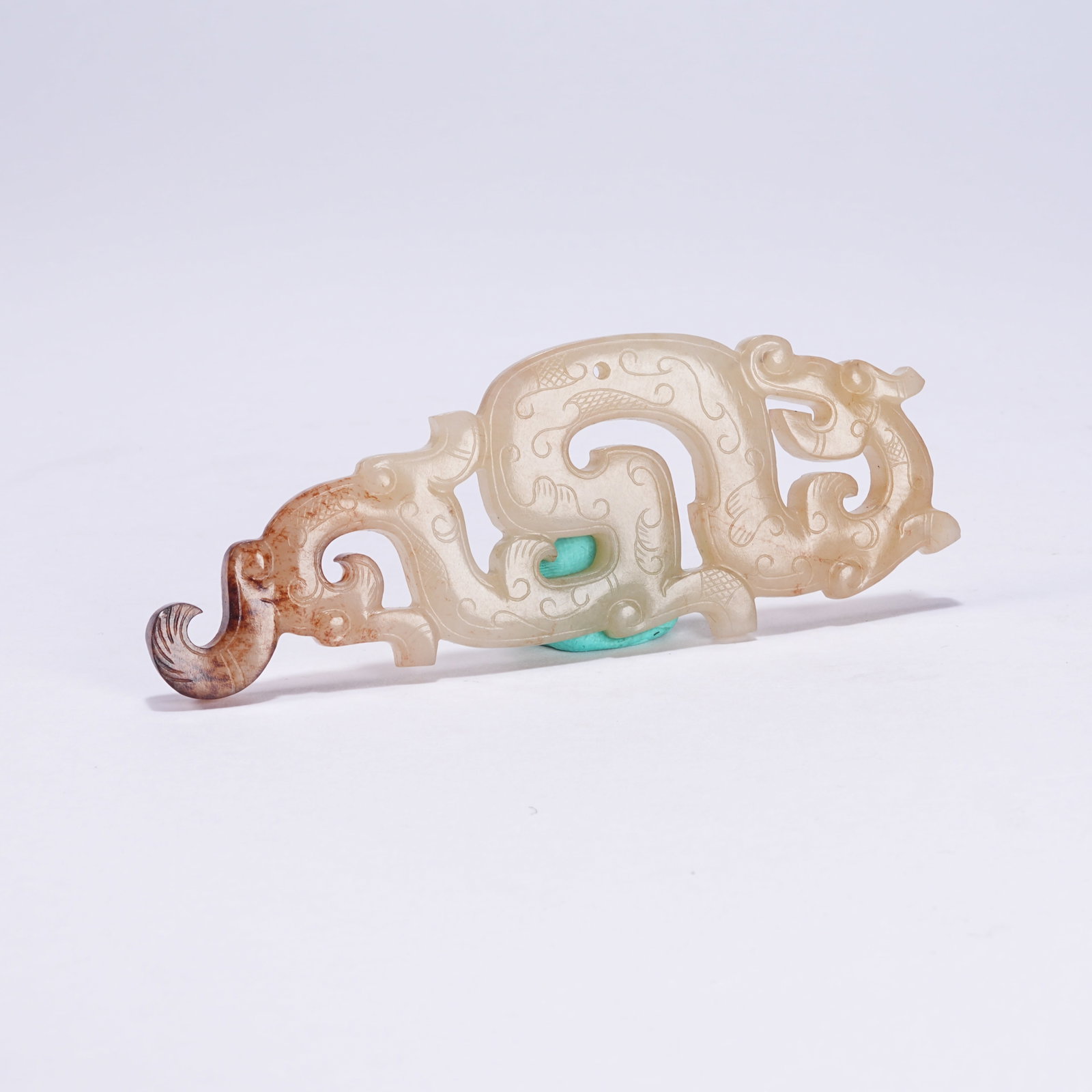 A ANCIENT JADE S-SHAPED DRAGON PENDANT: Ancient Jade S-shaped Dragon Pendant