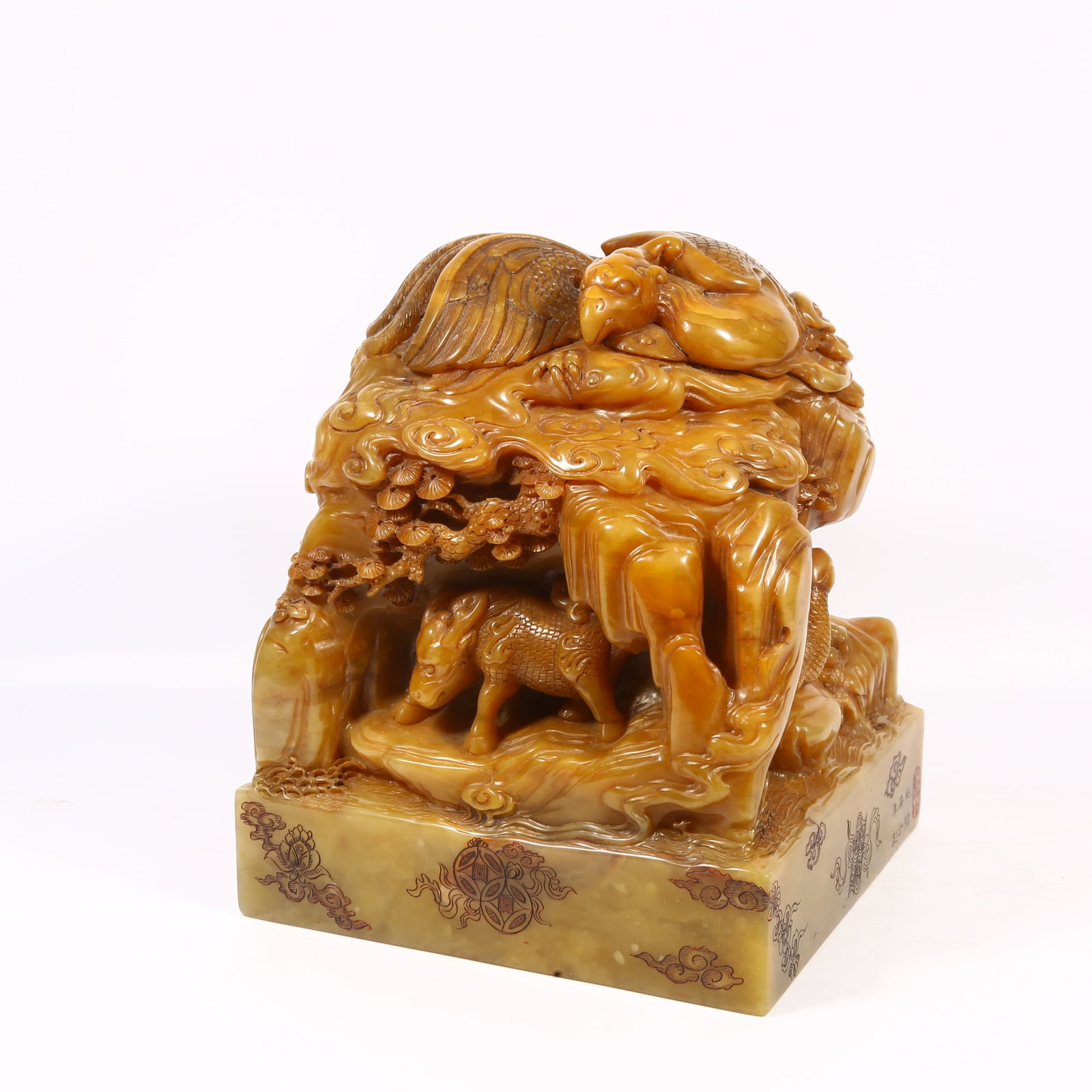 A SHOUSHAN STONE LARGE SEAL WITH FOUR SYMBOLS DESIGN: Shoushan stone large seal with four symbols design