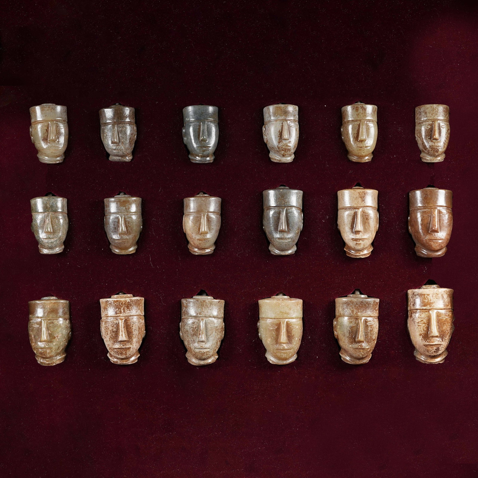 A SET OF EIGHTEEN ARCHAIC JADE BUDDHA'S HAND CITRONS: Set of eighteen archaic jade Buddha's hand citrons