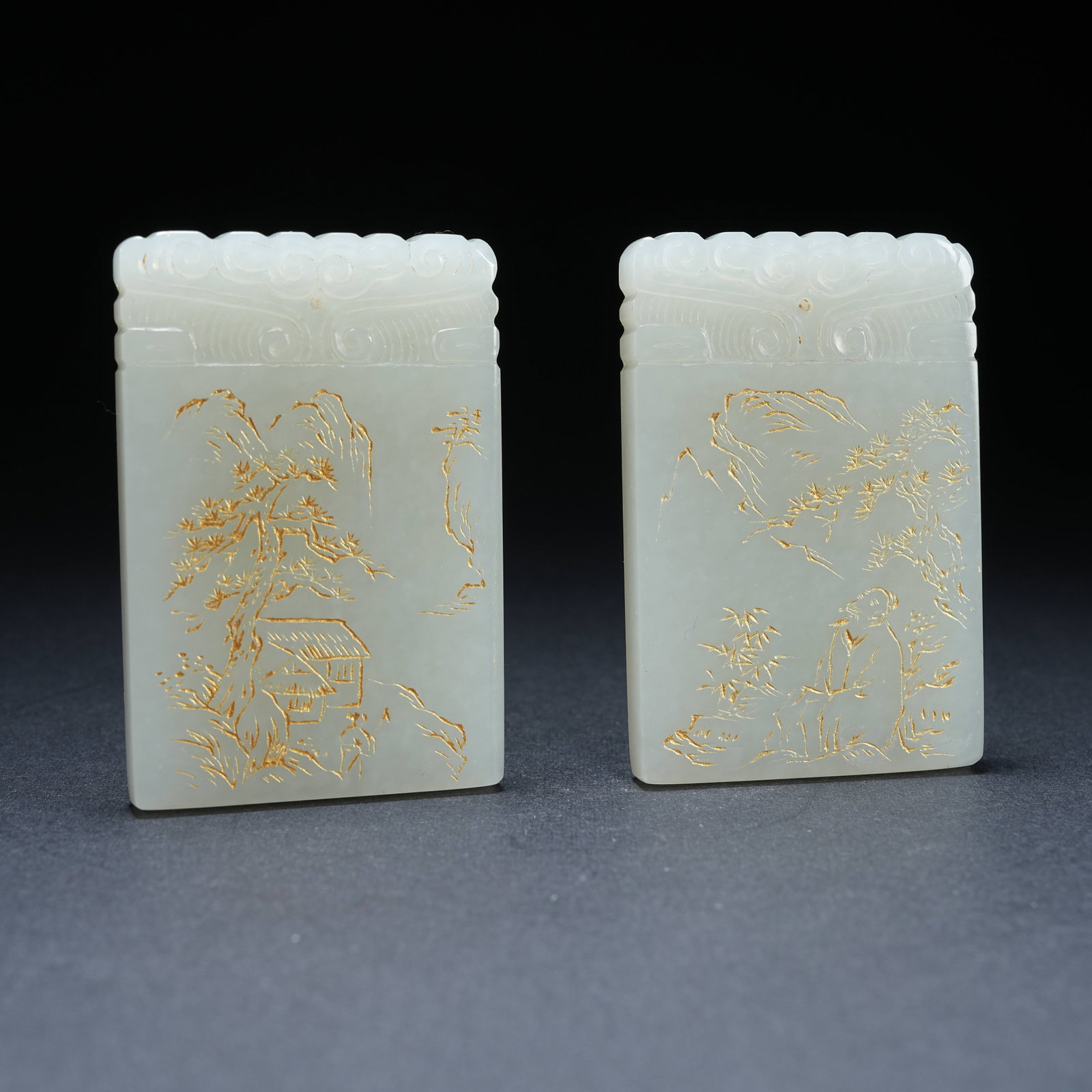 A HETIAN JADE GILDED LANDSCAPE AND FIGURE PATTERN PENDANT SET (1 of 10)