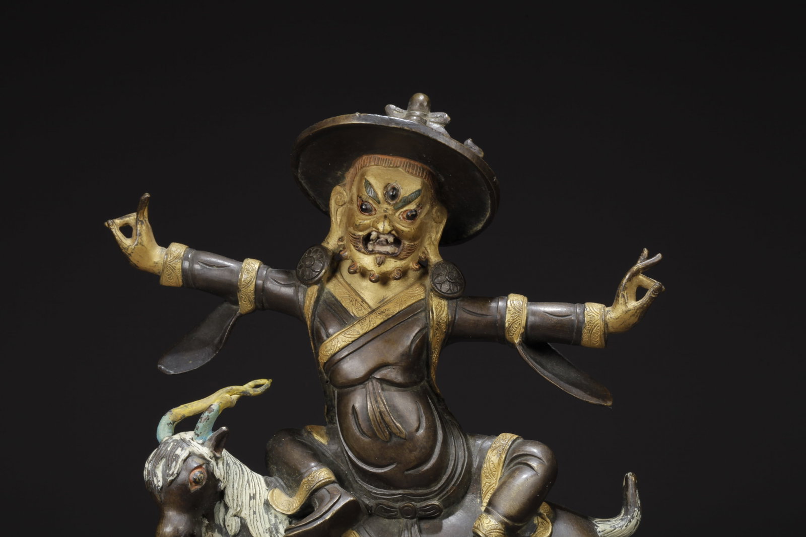 A GILDED BRONZE PROTECTOR DEITY STATUE - 2