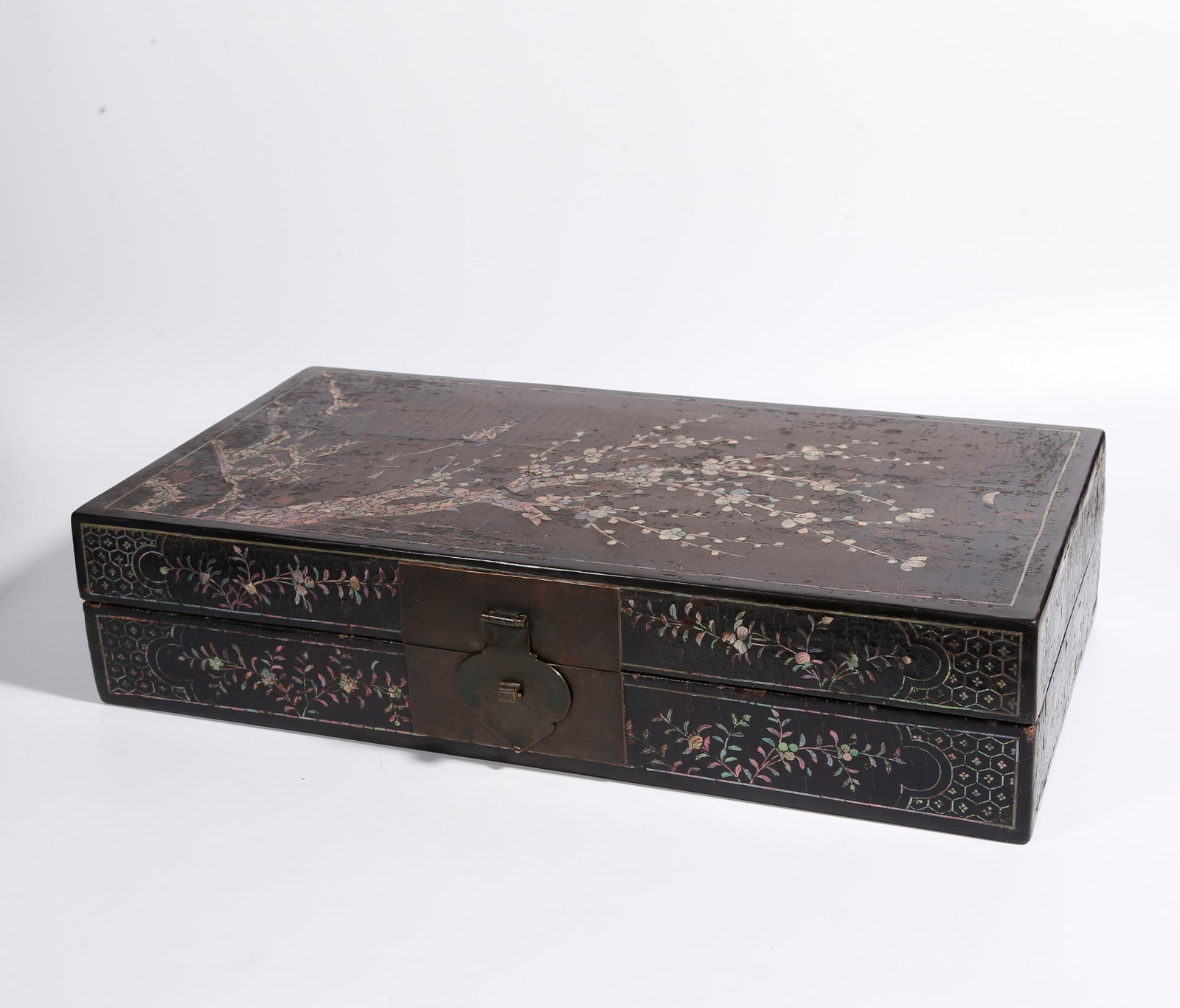 A LACQUER COVERED BOX INLAID WITH MOTHER-OF-PEARL PLUM BLOSSOM PATTERN: Lacquer Covered Box Inlaid with Mother-of-Pearl Plum Blossom Pattern