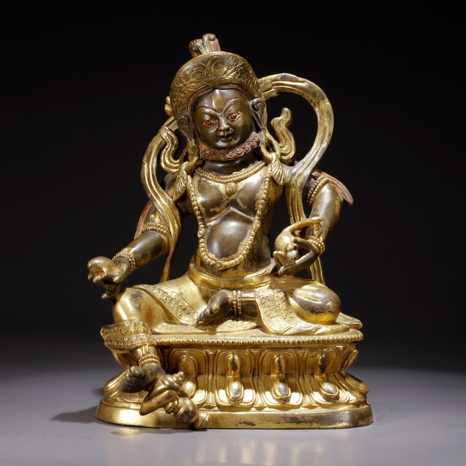 A GILDED BRONZE YELLOW WEALTH GOD STATUE: Gilded Bronze Yellow Wealth God Statue