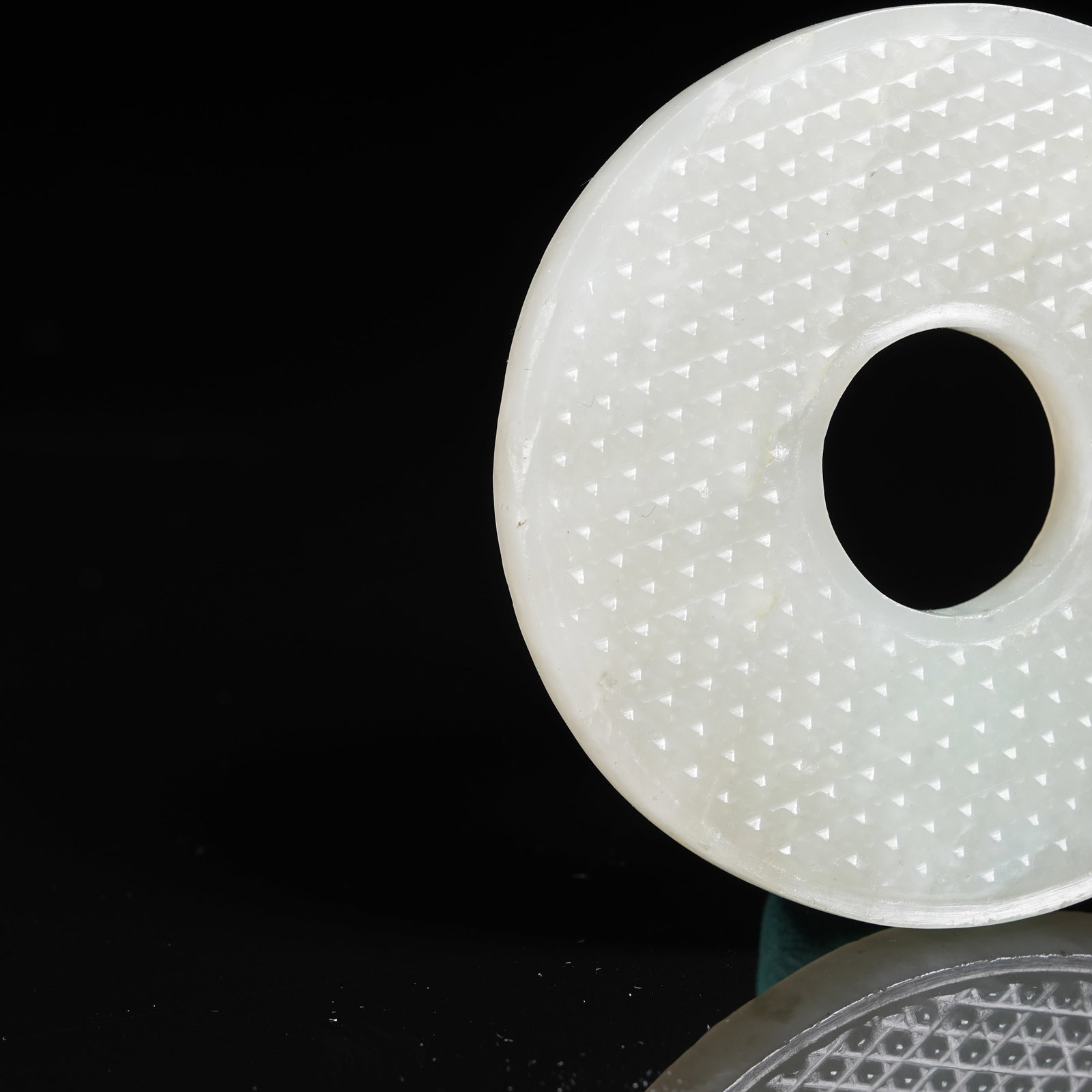 A NEPHRITE BI DISC WITH STUD PATTERN - 3