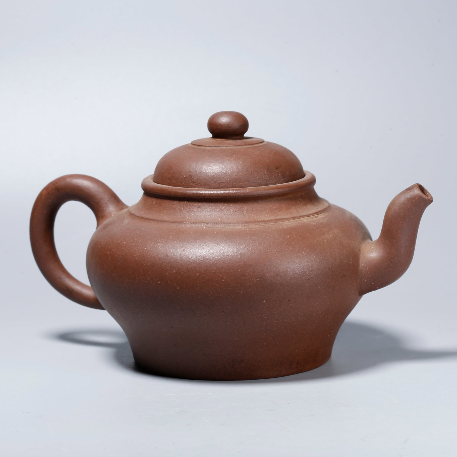 A ZISHA CARVED TEAPOT: Zisha Carved Teapot