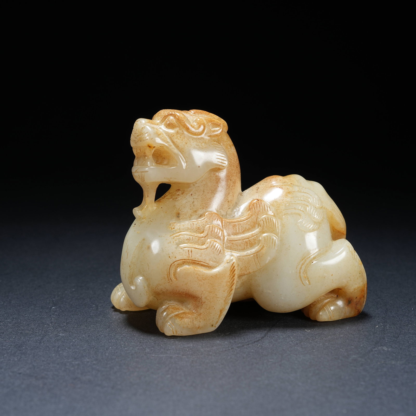 A ANCIENT JADE AUSPICIOUS BEAST ORNAMENT (1 of 8)