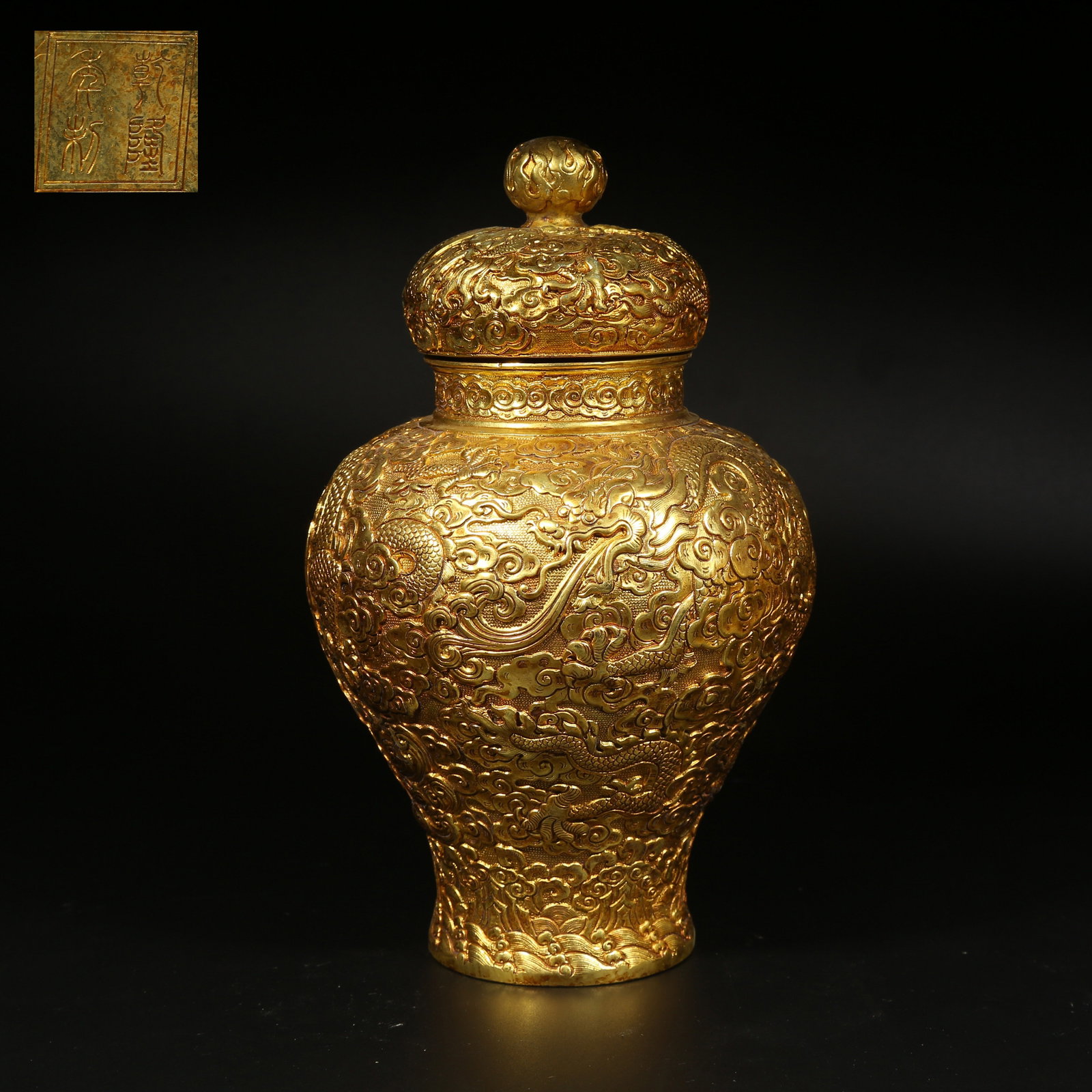 A GILT BRONZE COVERED VASE WITH CLOUD AND DRAGON DESIGN: Gilt Bronze Covered Vase with Cloud and Dragon Design