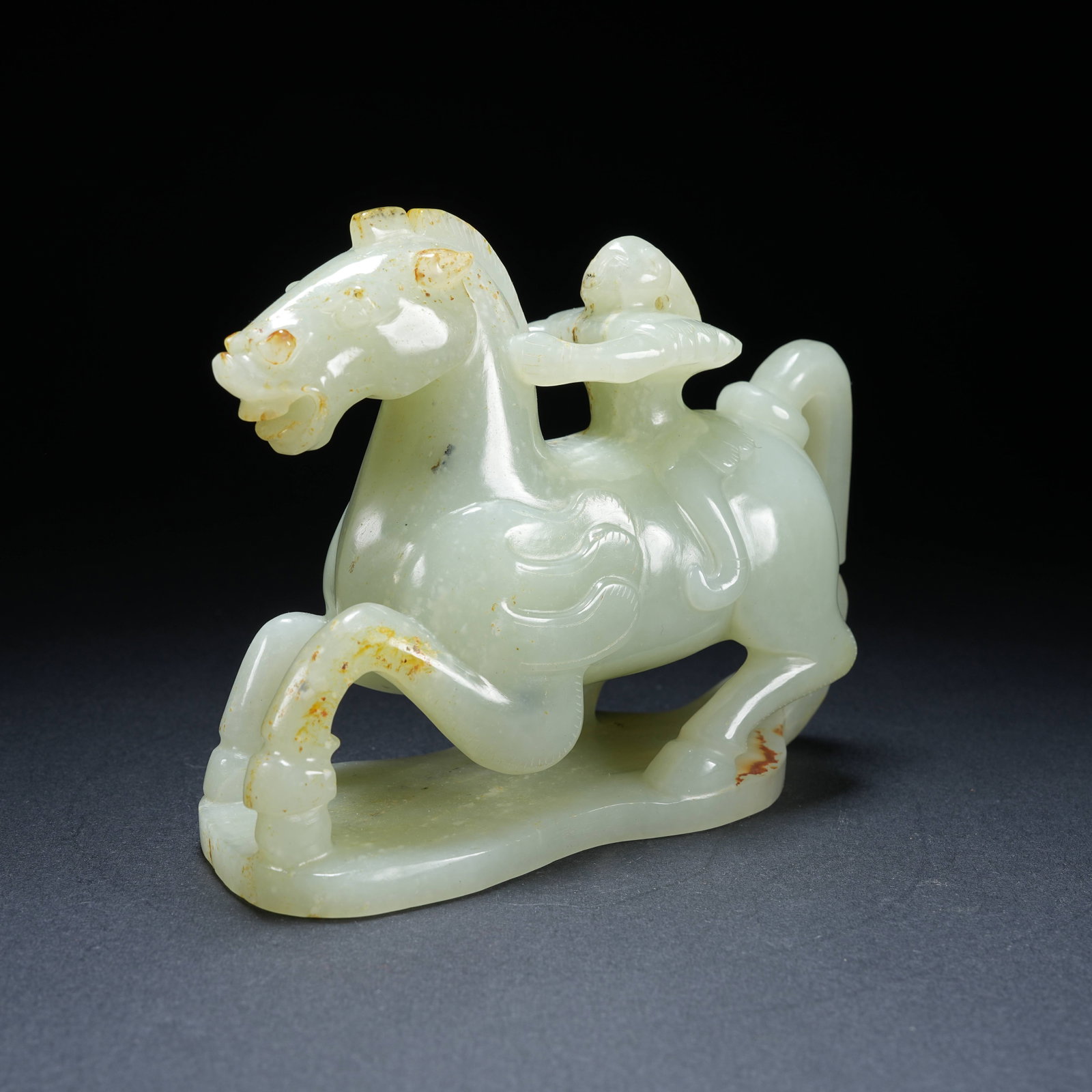 A HETIAN JADE IMMORTAL RIDING HEAVENLY HORSE ORNAMENT: Hetian Jade Immortal Riding Heavenly Horse Ornament