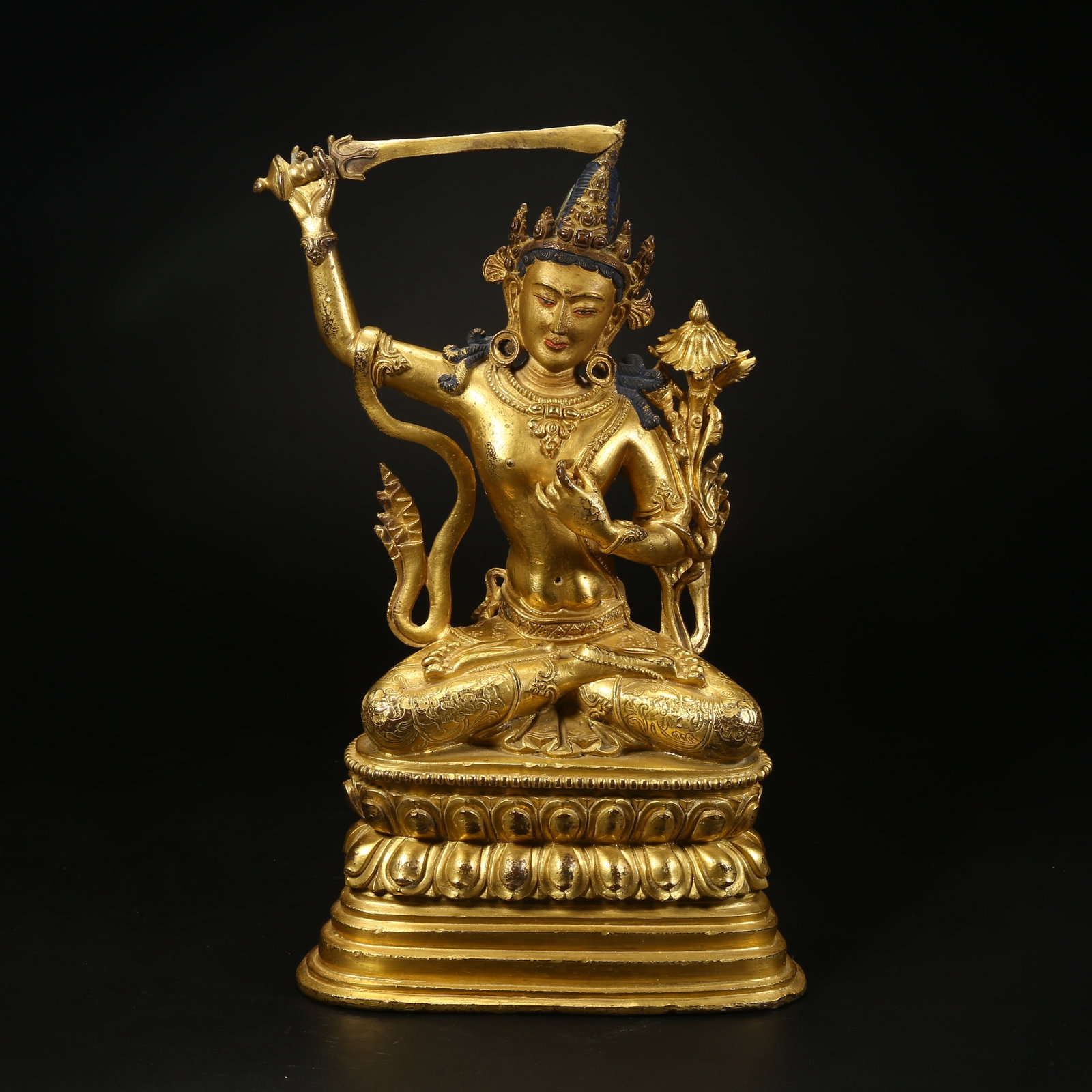 A GILT BRONZE STATUE OF MANJUSHRI BODHISATTVA: Gilt bronze statue of Manjushri Bodhisattva