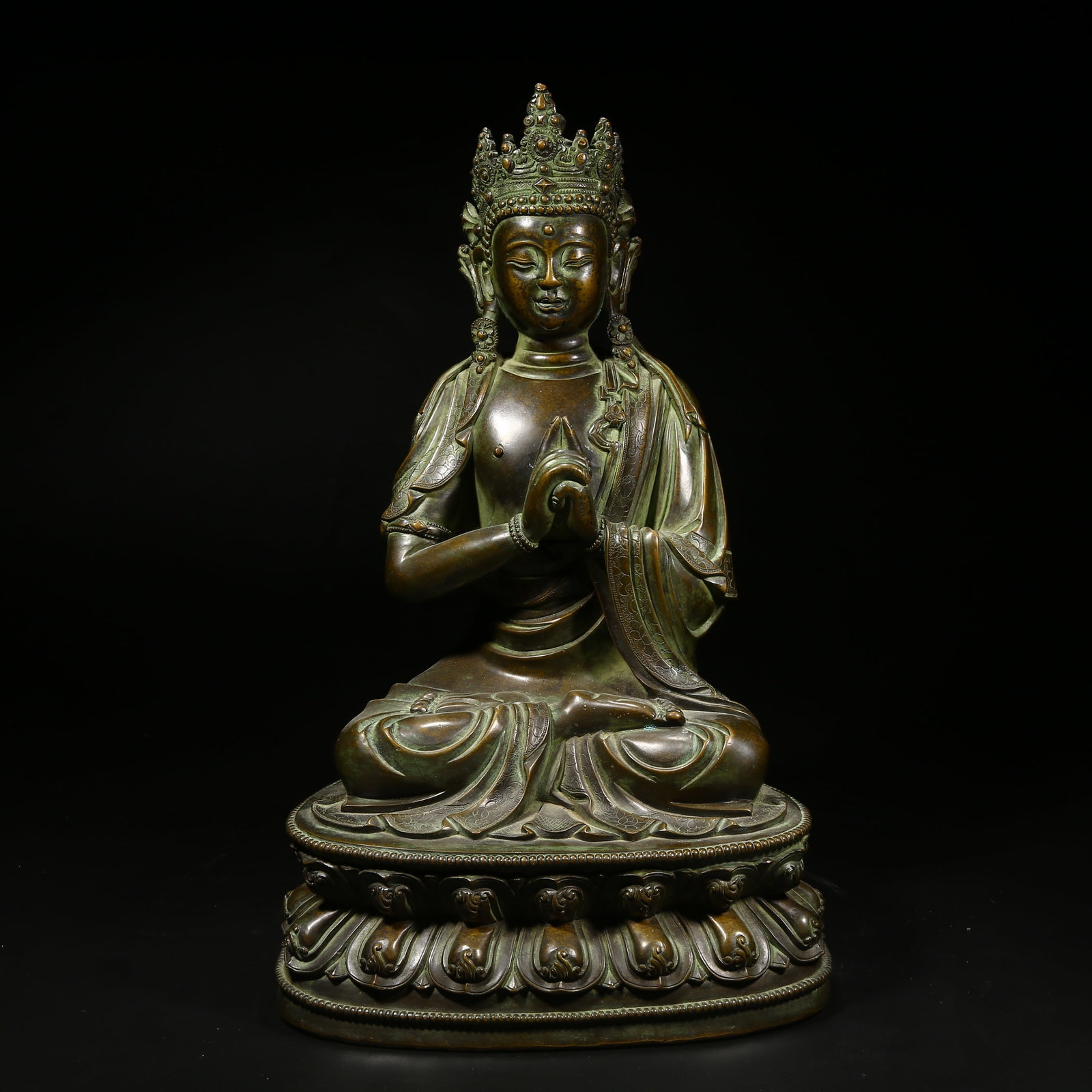 A BRONZE STATUE OF VAIROCANA BUDDHA: Bronze statue of Vairocana Buddha