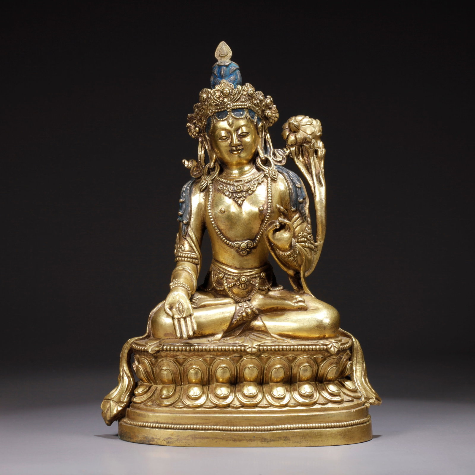 A GILDED BRONZE LOTUS-HOLDING AVALOKITESHVARA STATUE: Gilded Bronze Lotus-Holding Avalokiteshvara Statue