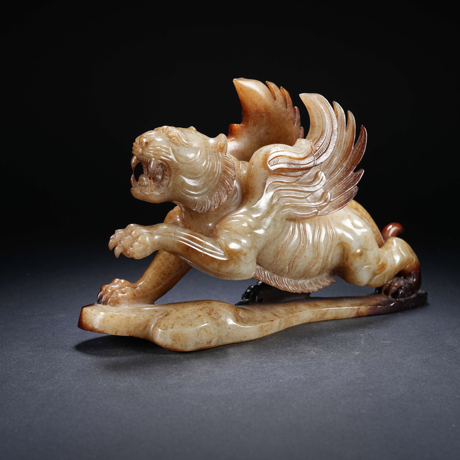 A ARCHAIC JADE FLYING TIGER ORNAMENT: Archaic jade flying tiger ornament