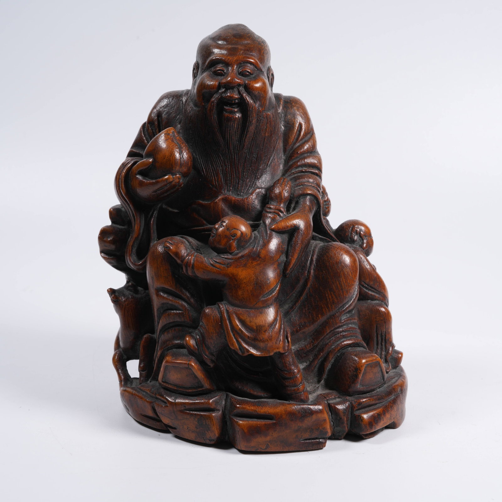 A BAMBOO ROOT CARVED ORNAMENT OF BOY PRESENTING LONGEVITY (1 of 9)